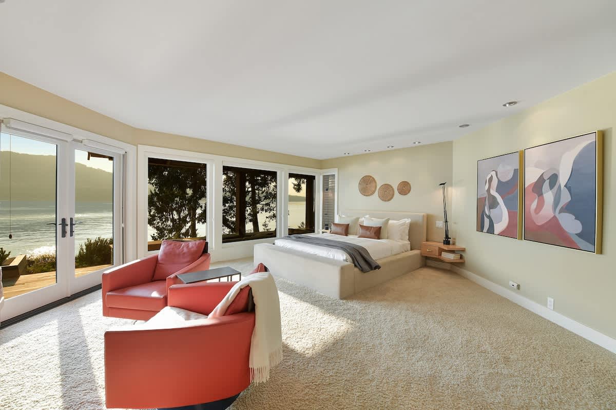 Immaculate primary bedroom with sweeping views and incredible ensuite.