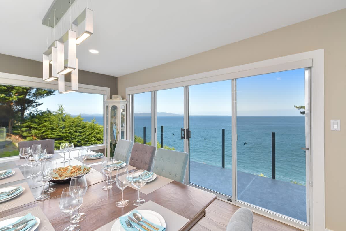 Dining room seats 8 with amazing views on the main floor.