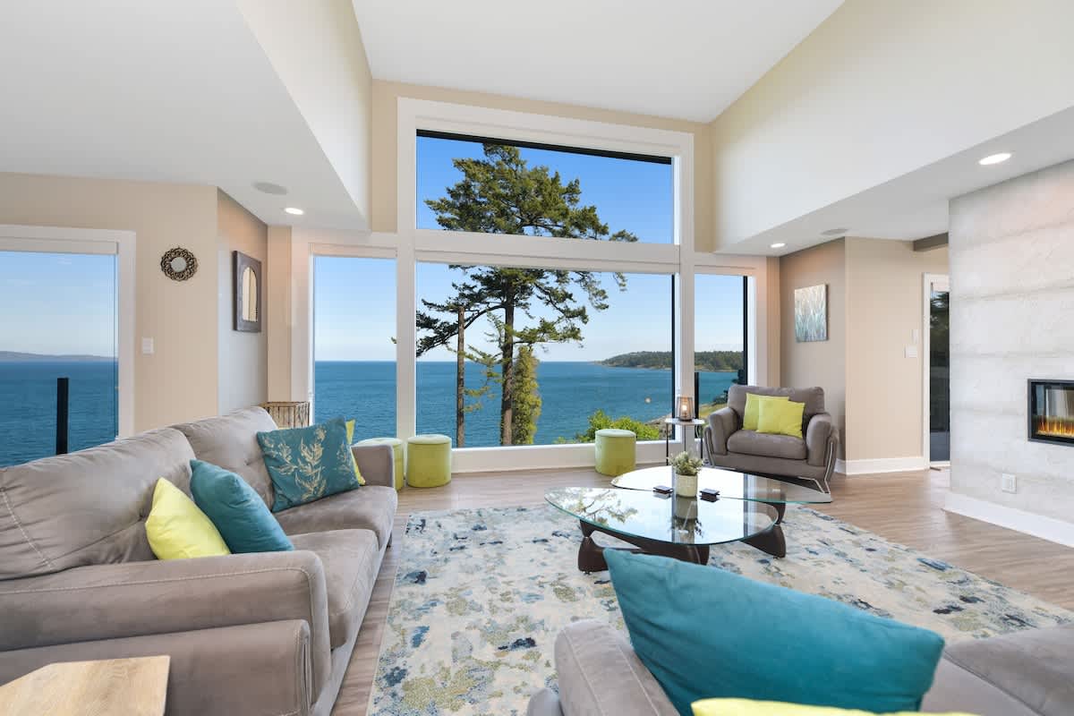 Main floor well appointed living room with spectacular views of the ocean and islands.