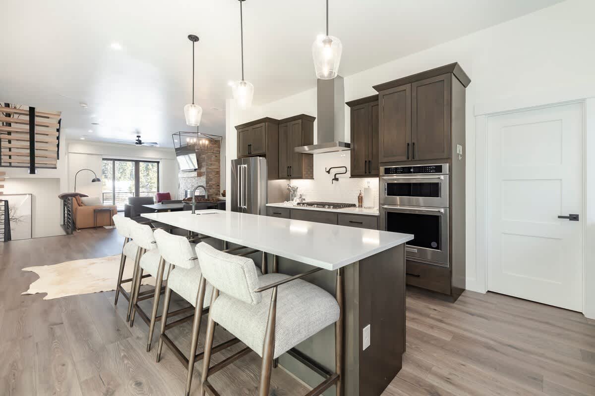 - Enjoy open concept living with a kitchen that flows into dining and lounging areas
- Oversized island offers seating for four and a prep space built for real cooks
- Light filled and beautifully styled for comfort and ease