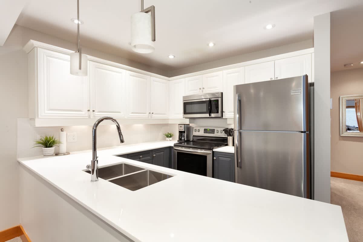 - Modern Whistler kitchen with stainless steel appliances 
- Fully equipped for gourmet cooking and cozy meals 
- Sleek countertops and open layout for social dining 
