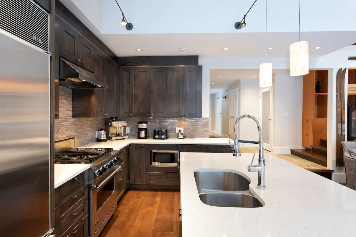 Contemporary appliances and ample counterspace in the kitchen