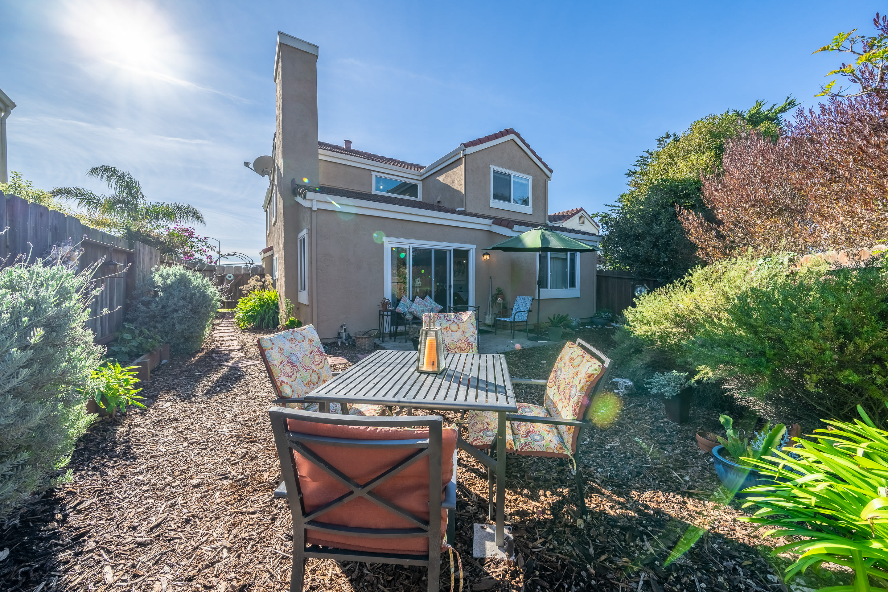 Relish the backyard's fresh air and comfortable seating