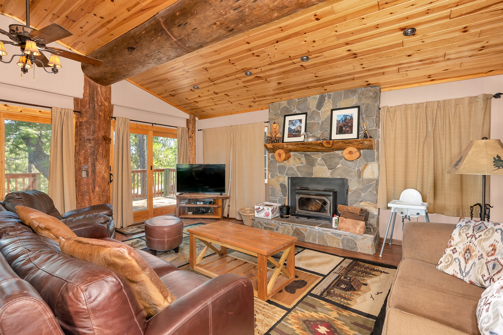 Cozy and spacious living area with TV and fireplace