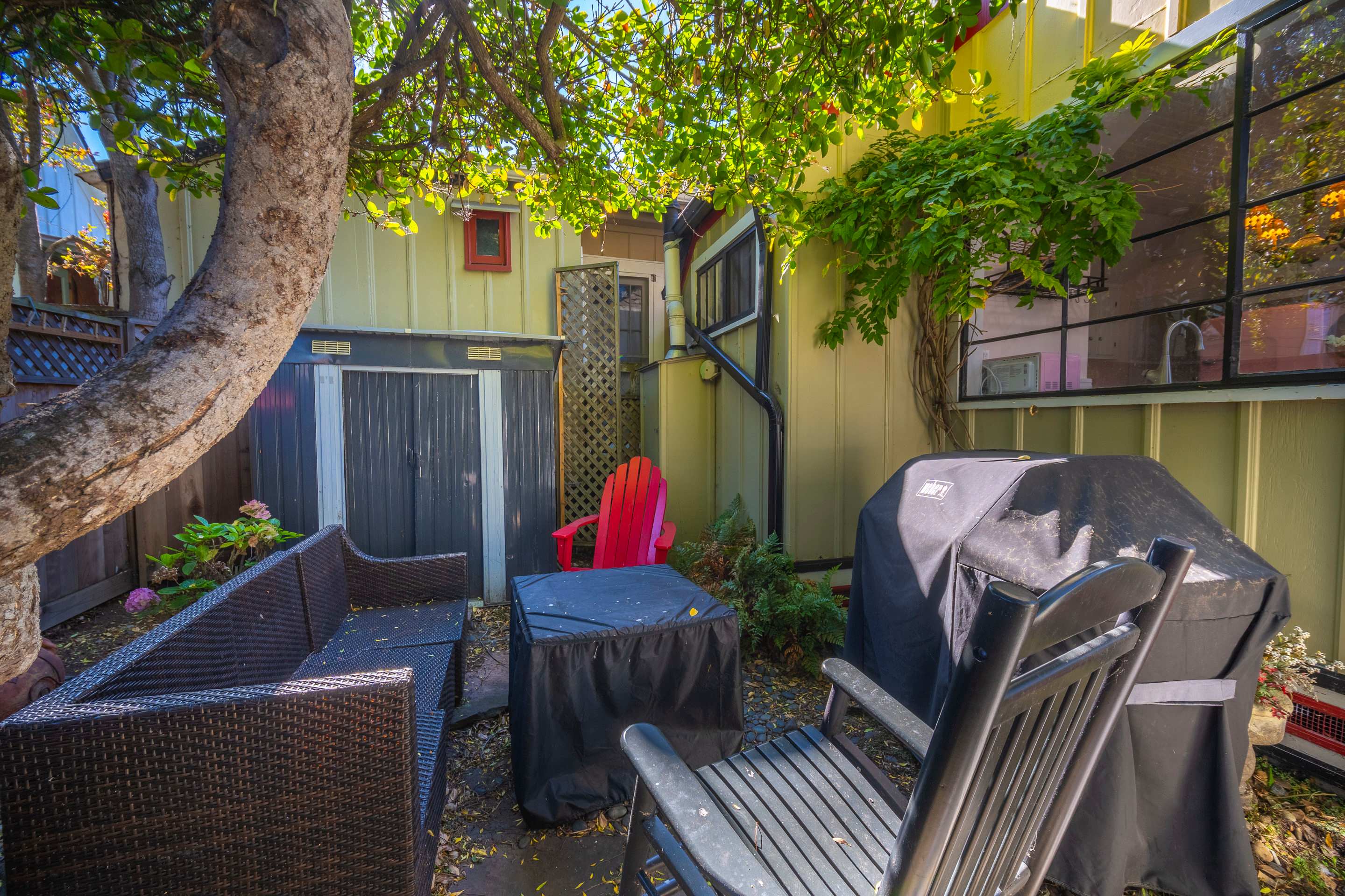 Relax and enjoy the fresh air in this cozy backyard space