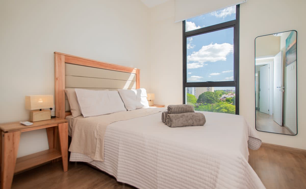 1BR w/ Balcony | Walk to Malls | Pool + Gym