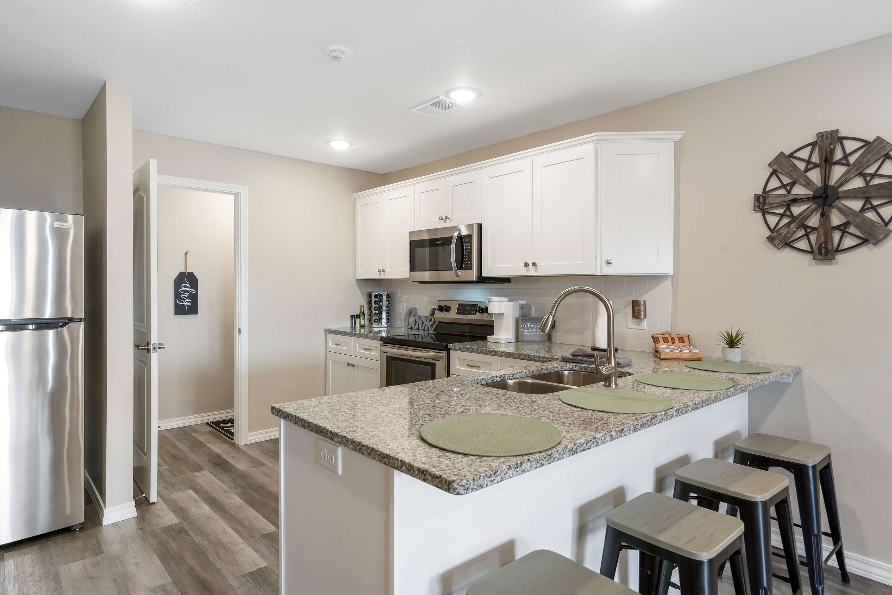 The open, airy kitchen offers ample space & every home comfort