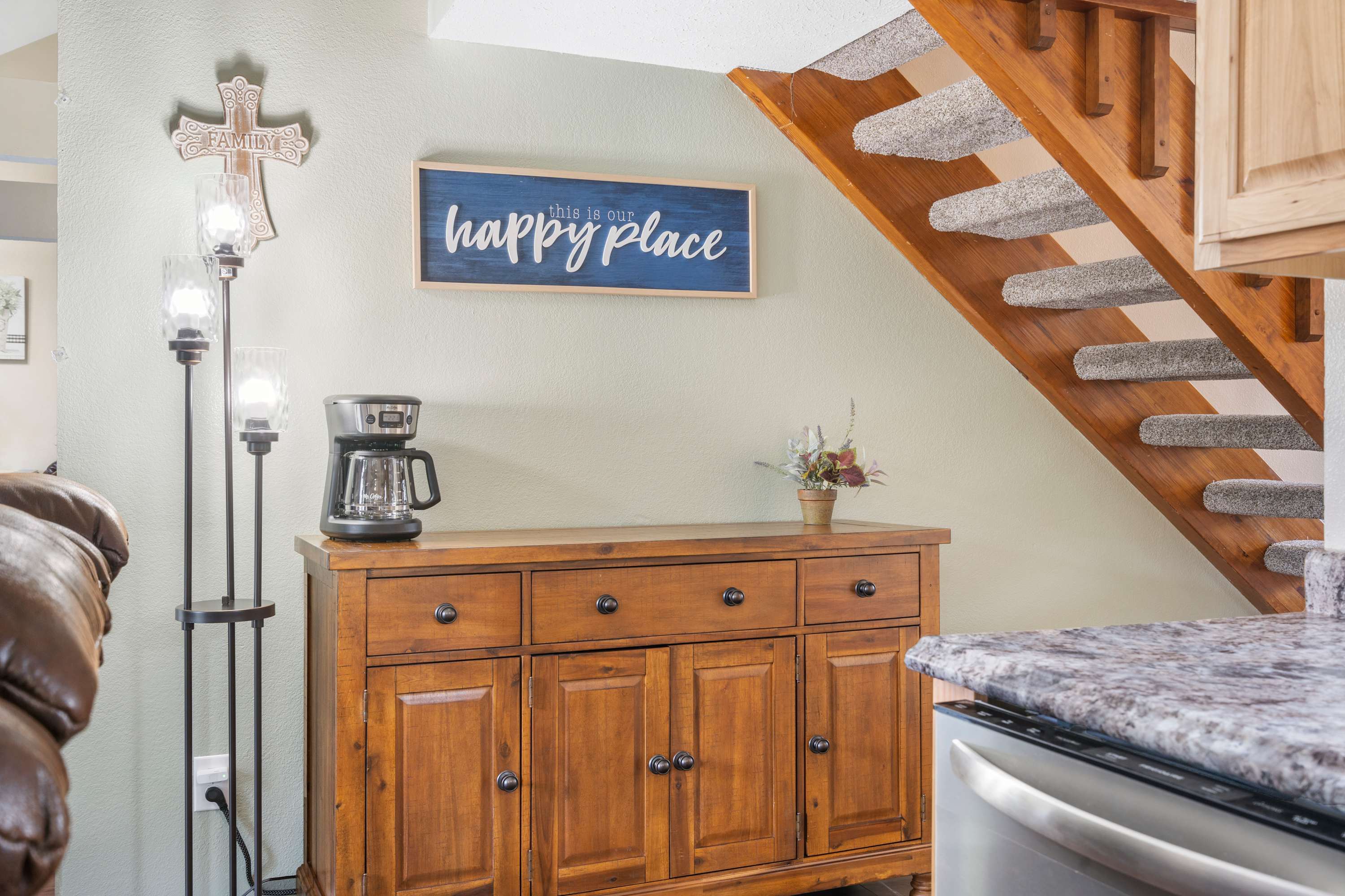 Private laundry is available for your stay, tucked at end of kitchen