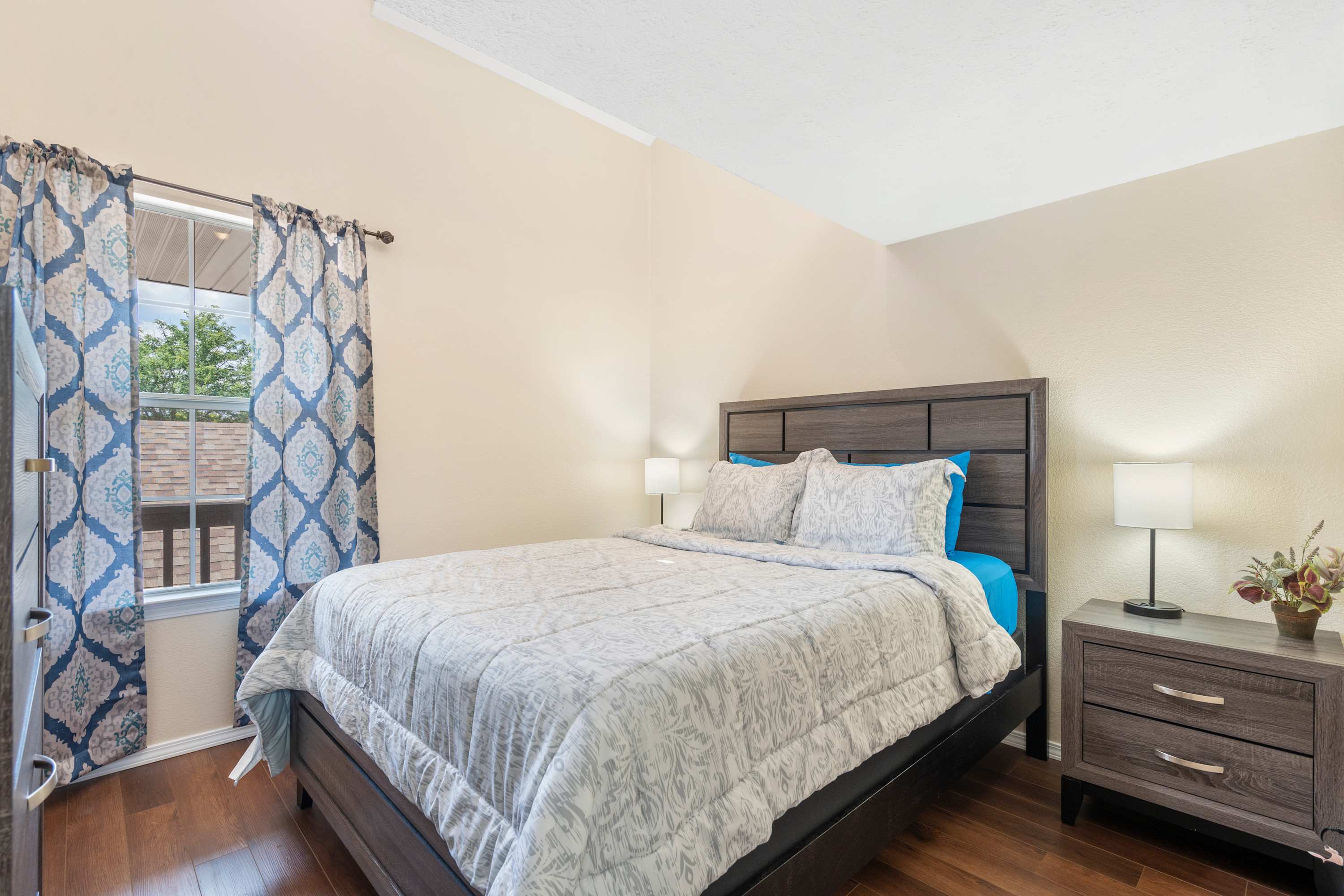 This chic suite offers a plush queen bed, private ensuite & smart TV