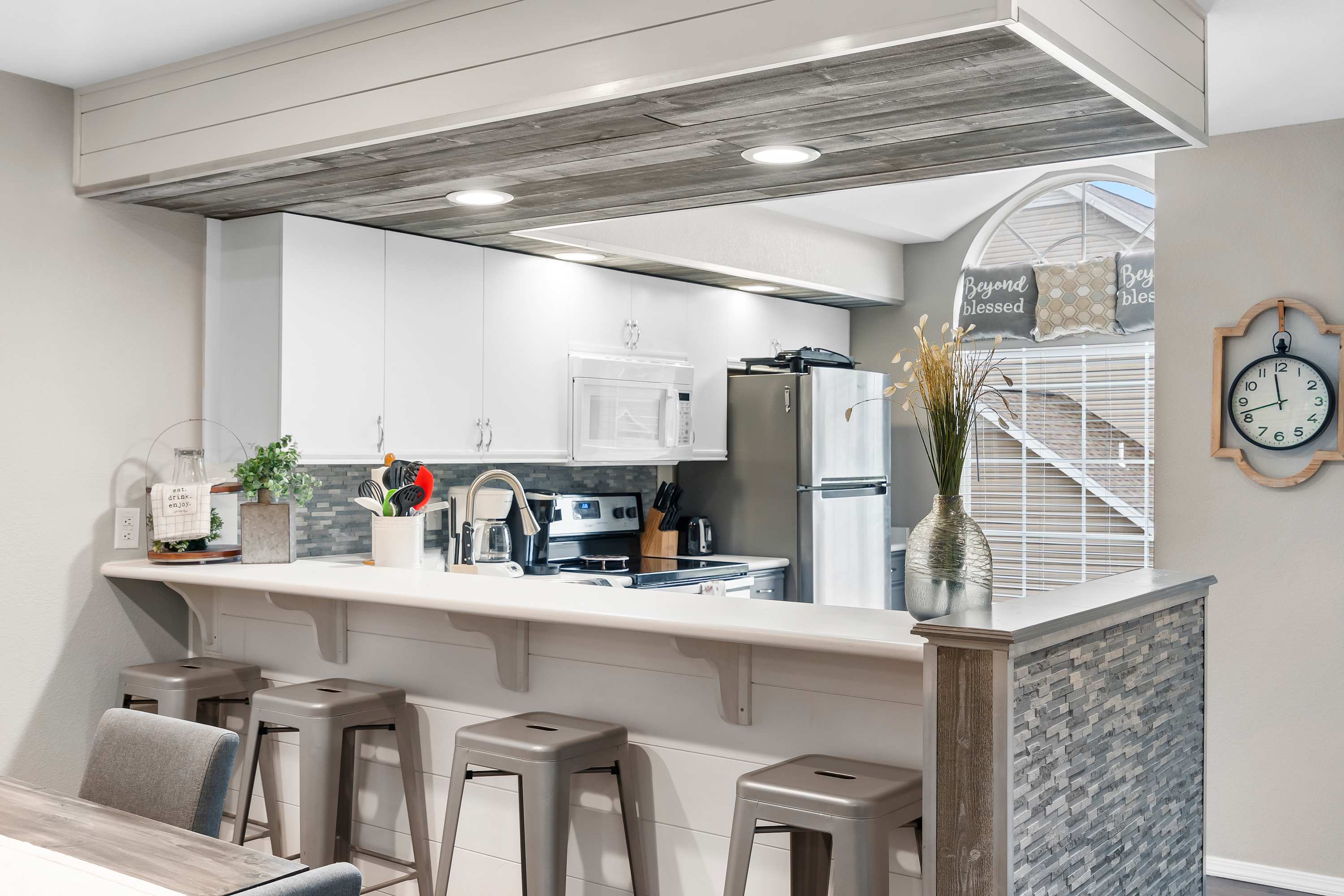 Sip morning coffee or grab a bite at the kitchen counter, seating 4