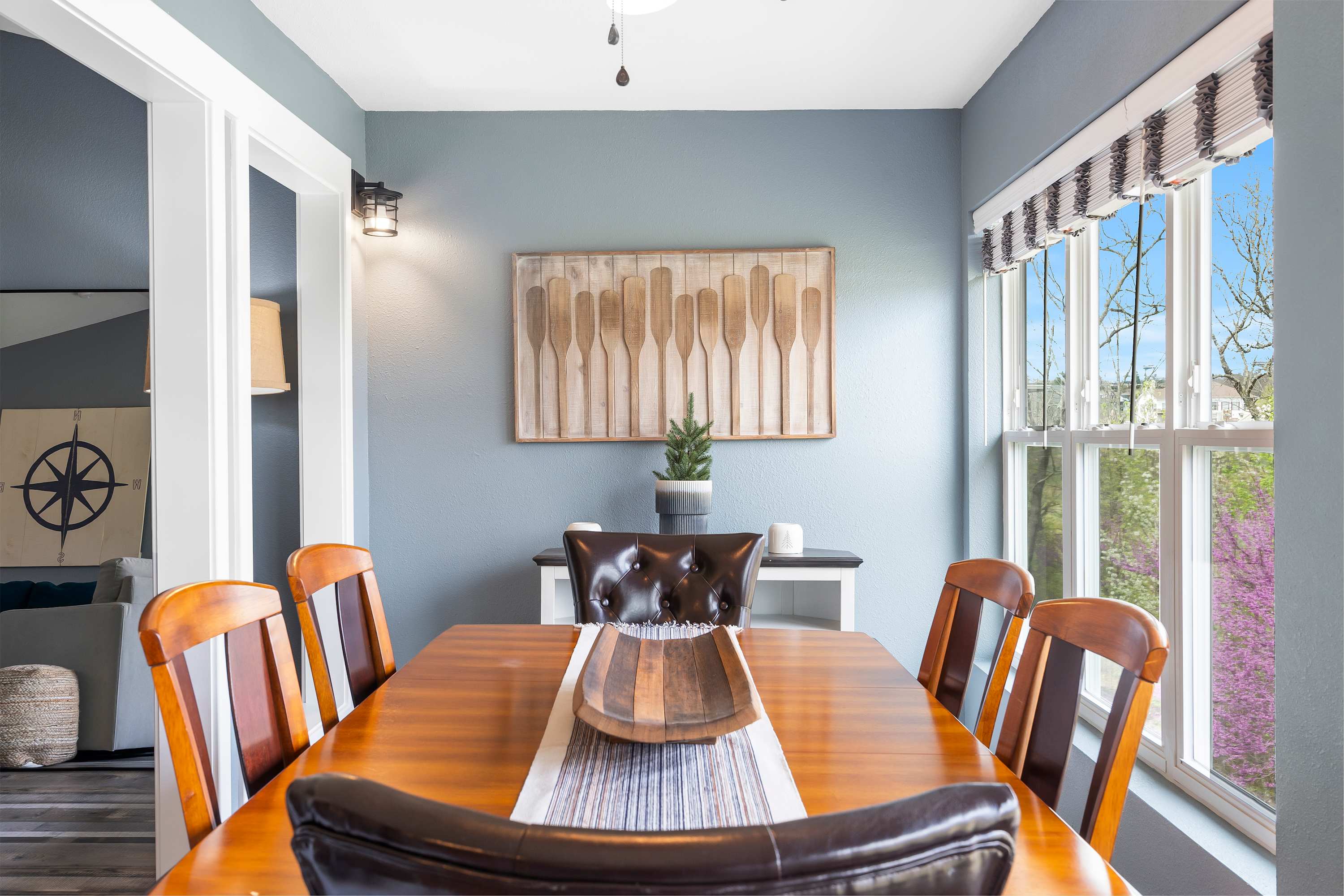 Gather for elegant meals together at the dining table, offering seating for 6