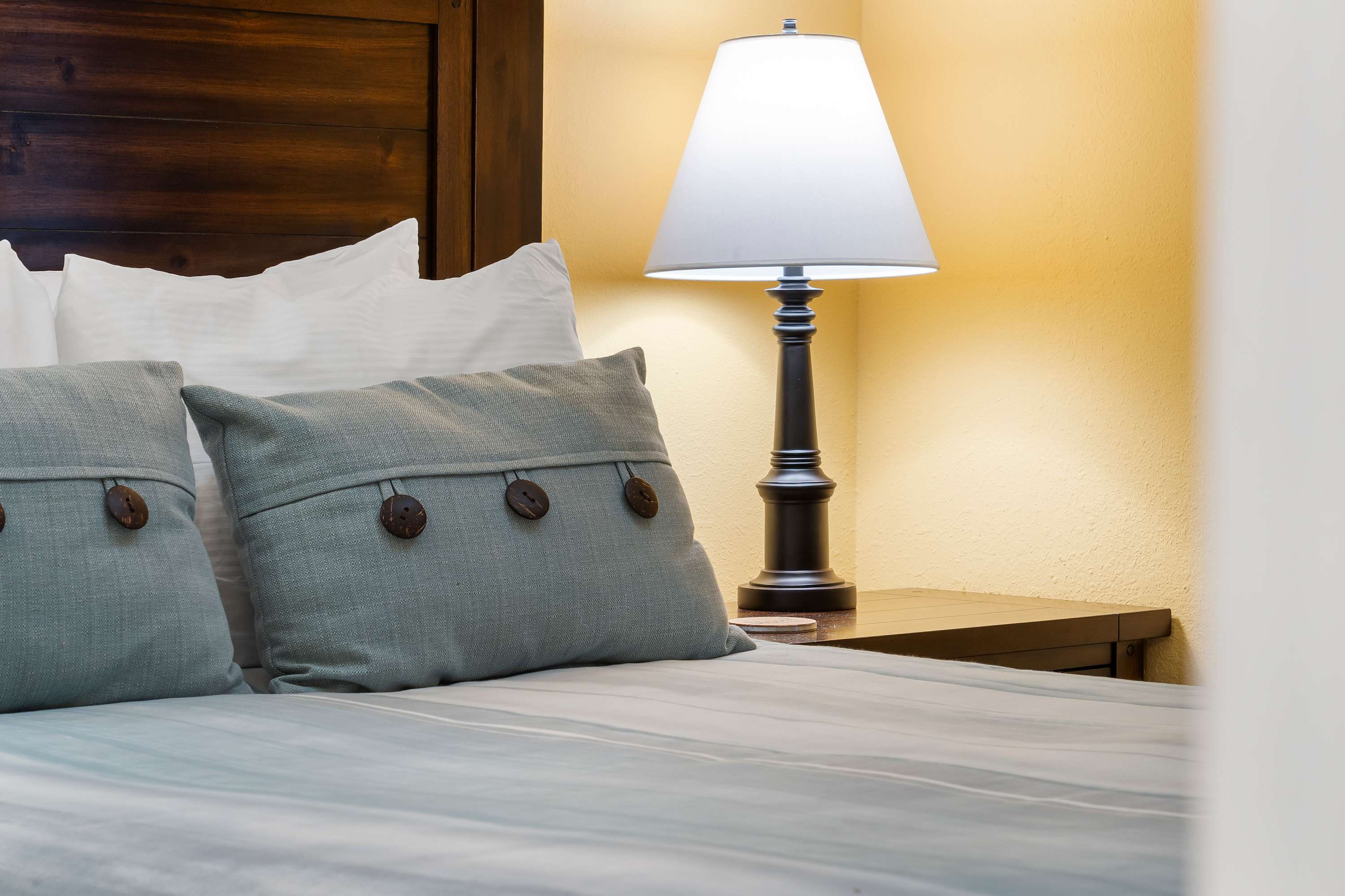 The cheerful main-level queen suite features a private ensuite & Smart TV