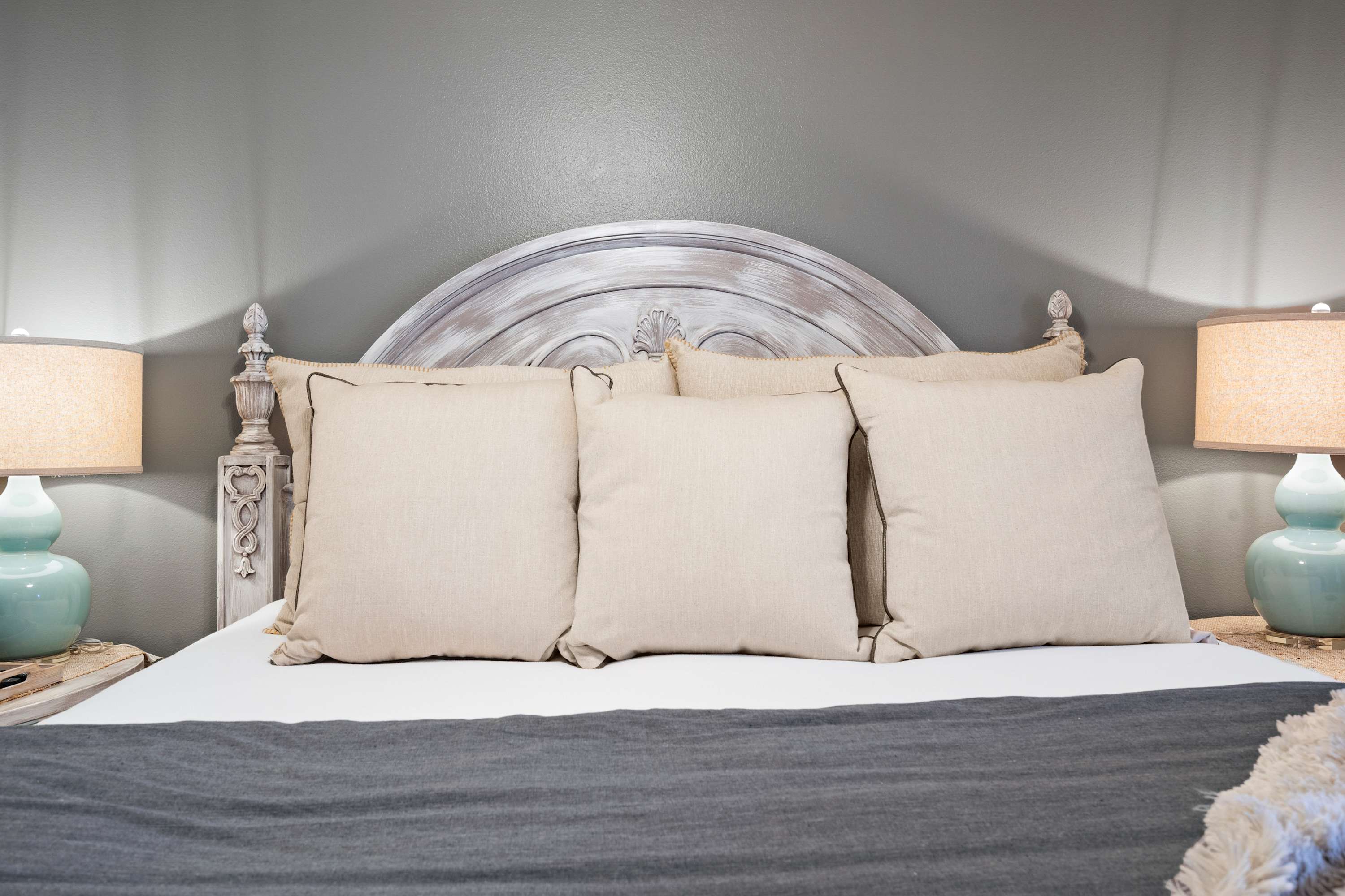 The first chic bedroom retreat boasts a plush king bed & Smart TV