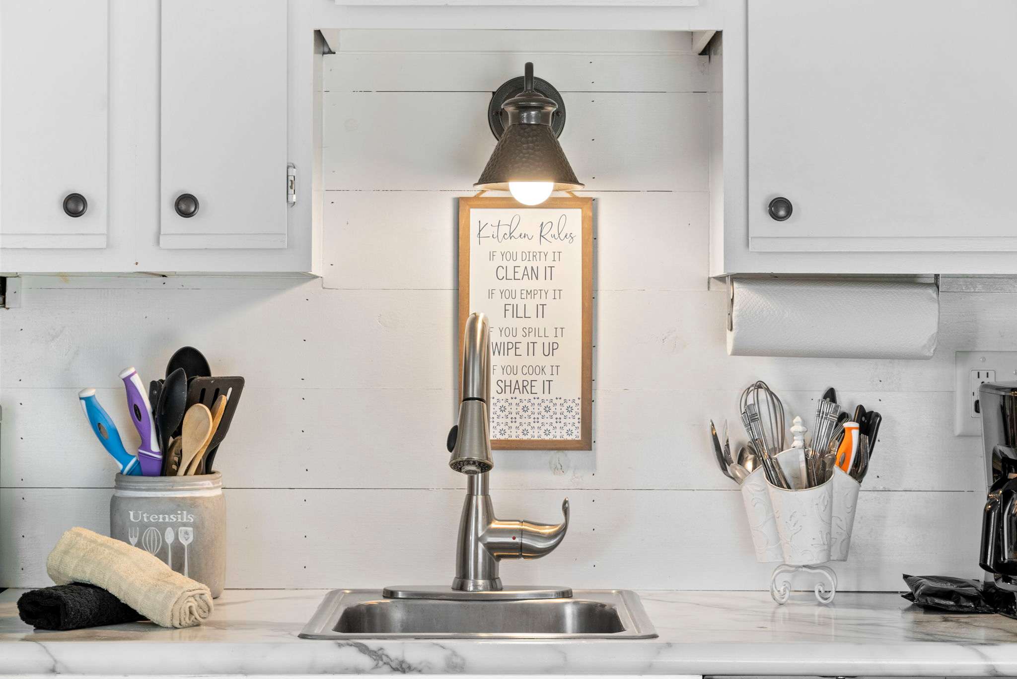 The open kitchen offers ample storage space & all the comforts of home