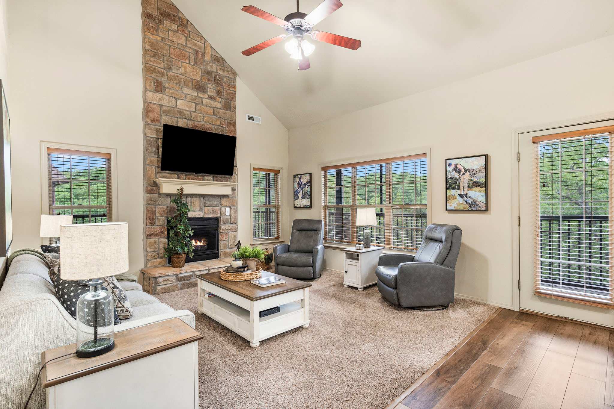 Cozy and spacious living area with TV and fireplace