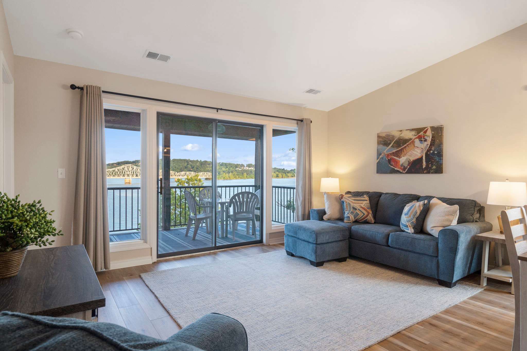 Floor-to-ceiling sliding glass doors in the living area