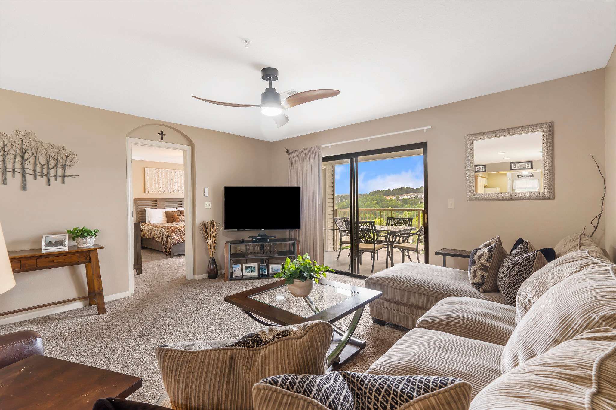 Modern spacious living area with TV