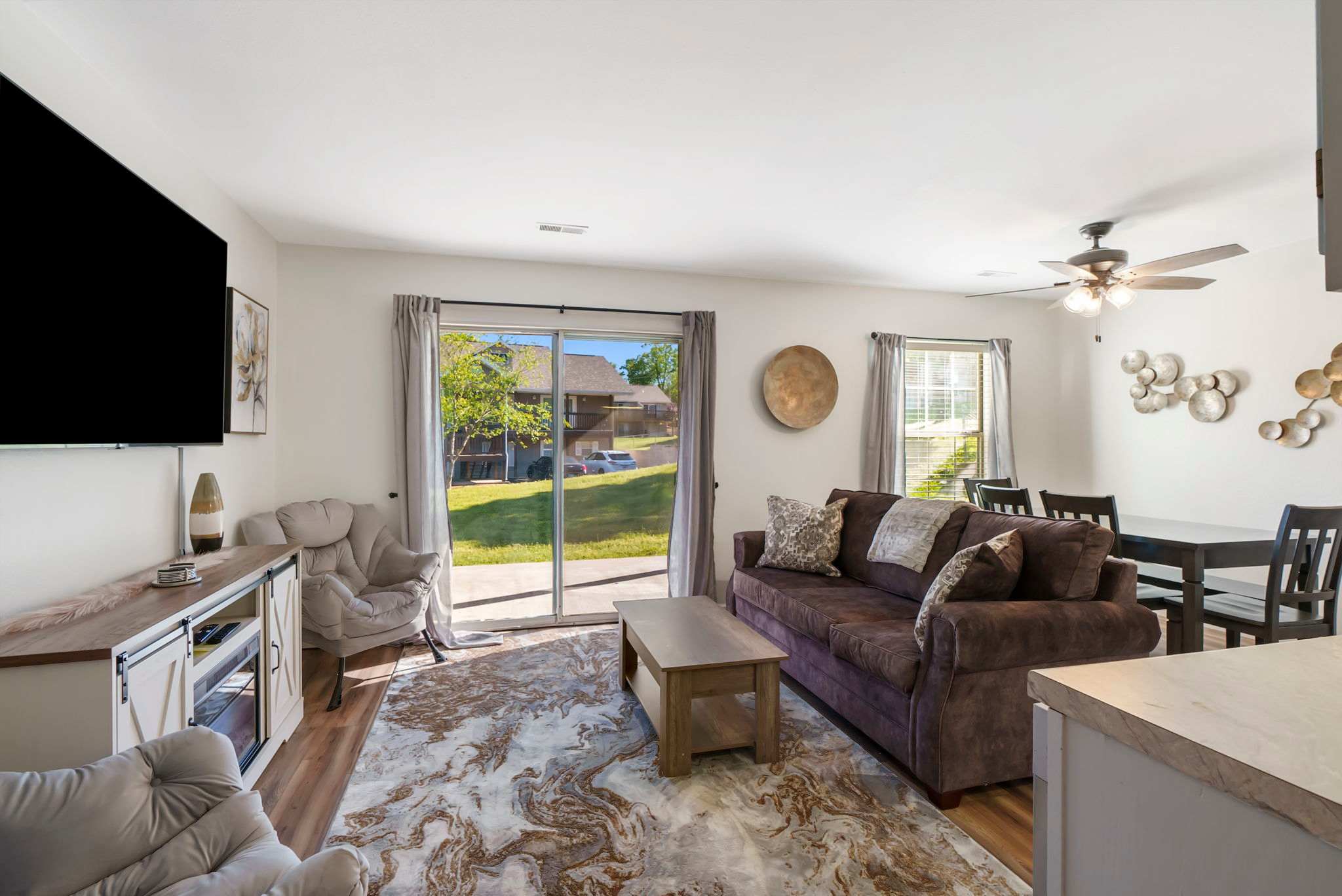 Enjoy comfortable furnishings and open-concept flexibility in the Living/Dining Areas and Kitchen