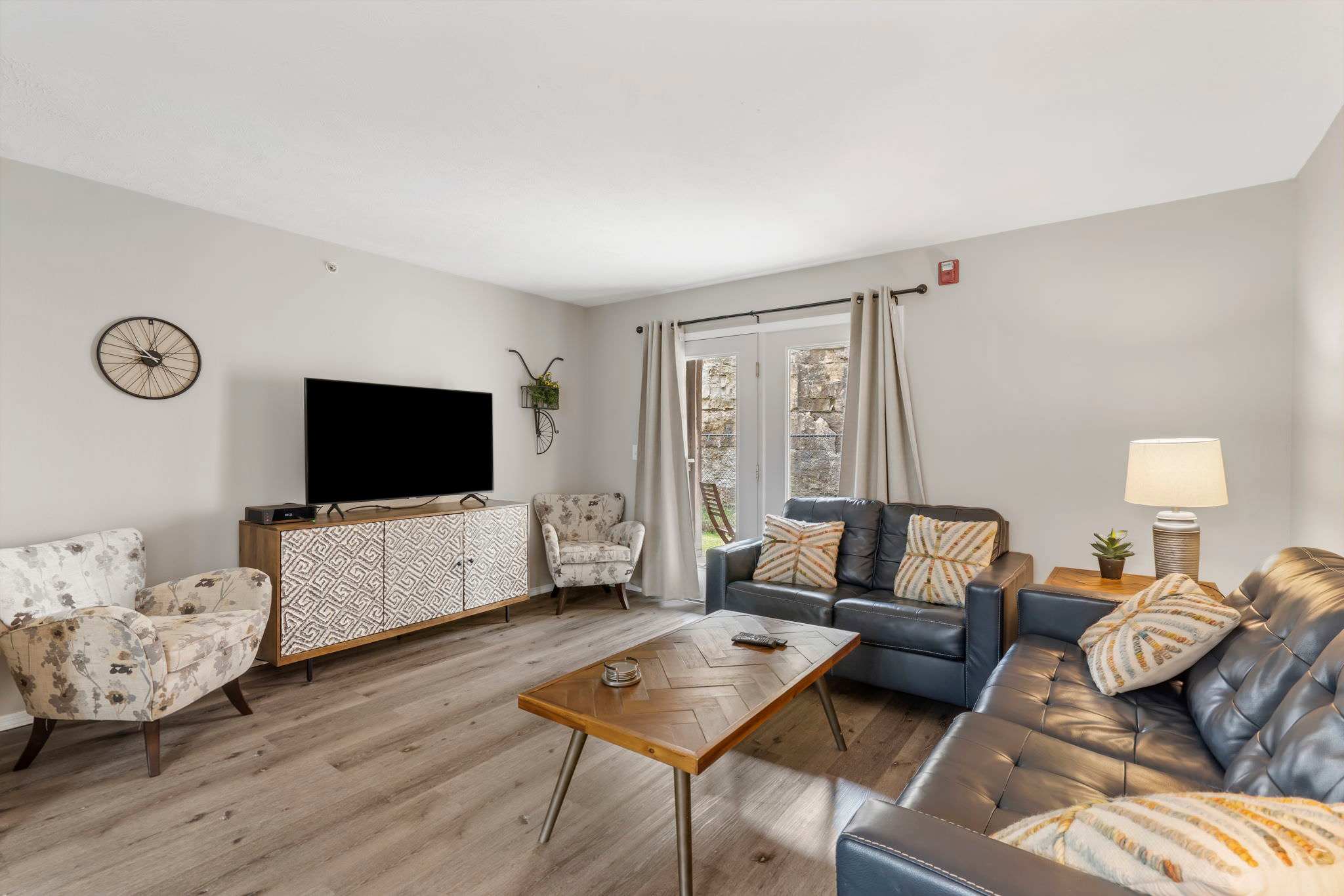 Cozy and spacious living area with TV