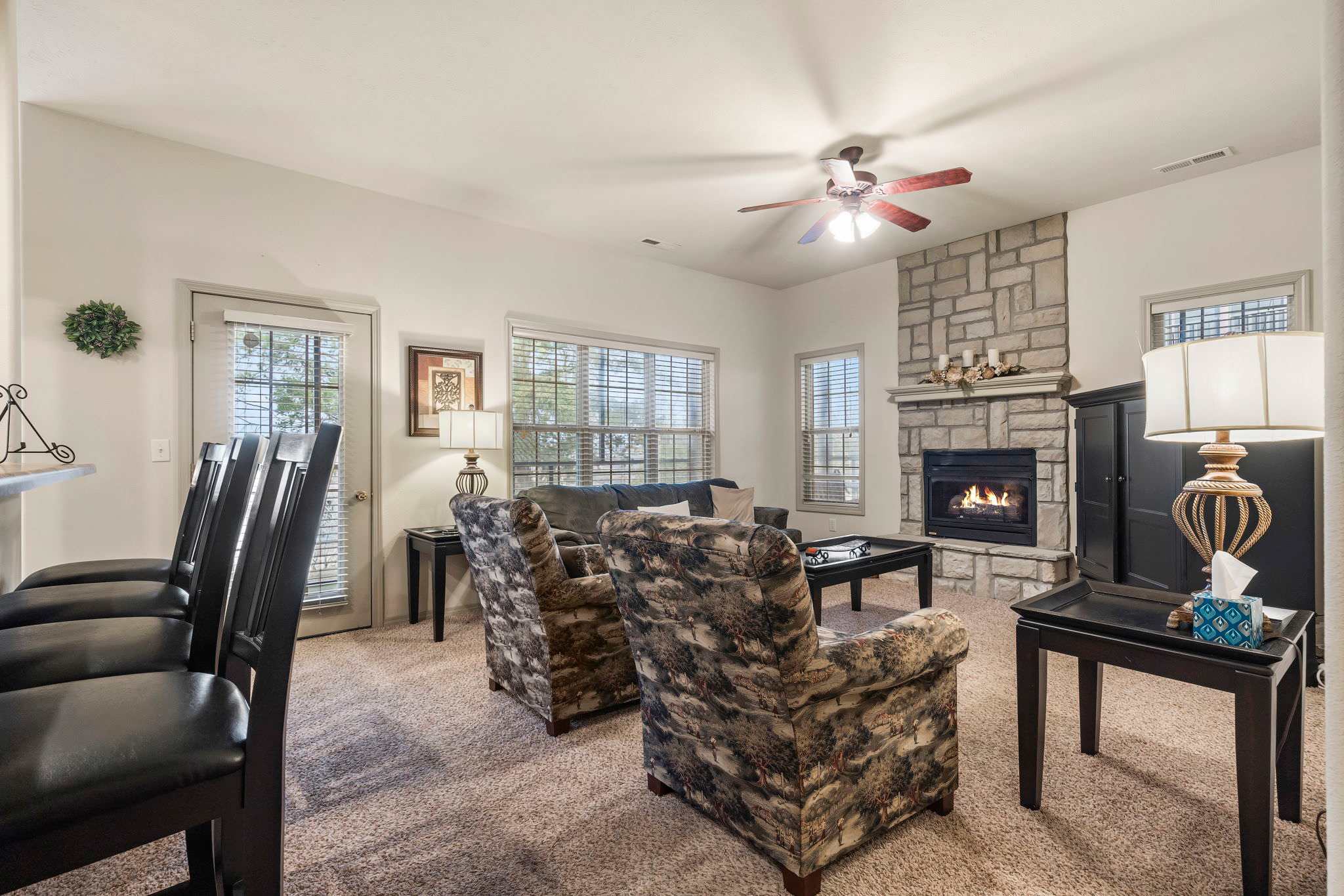 Modern spacious living area with TV and fireplace