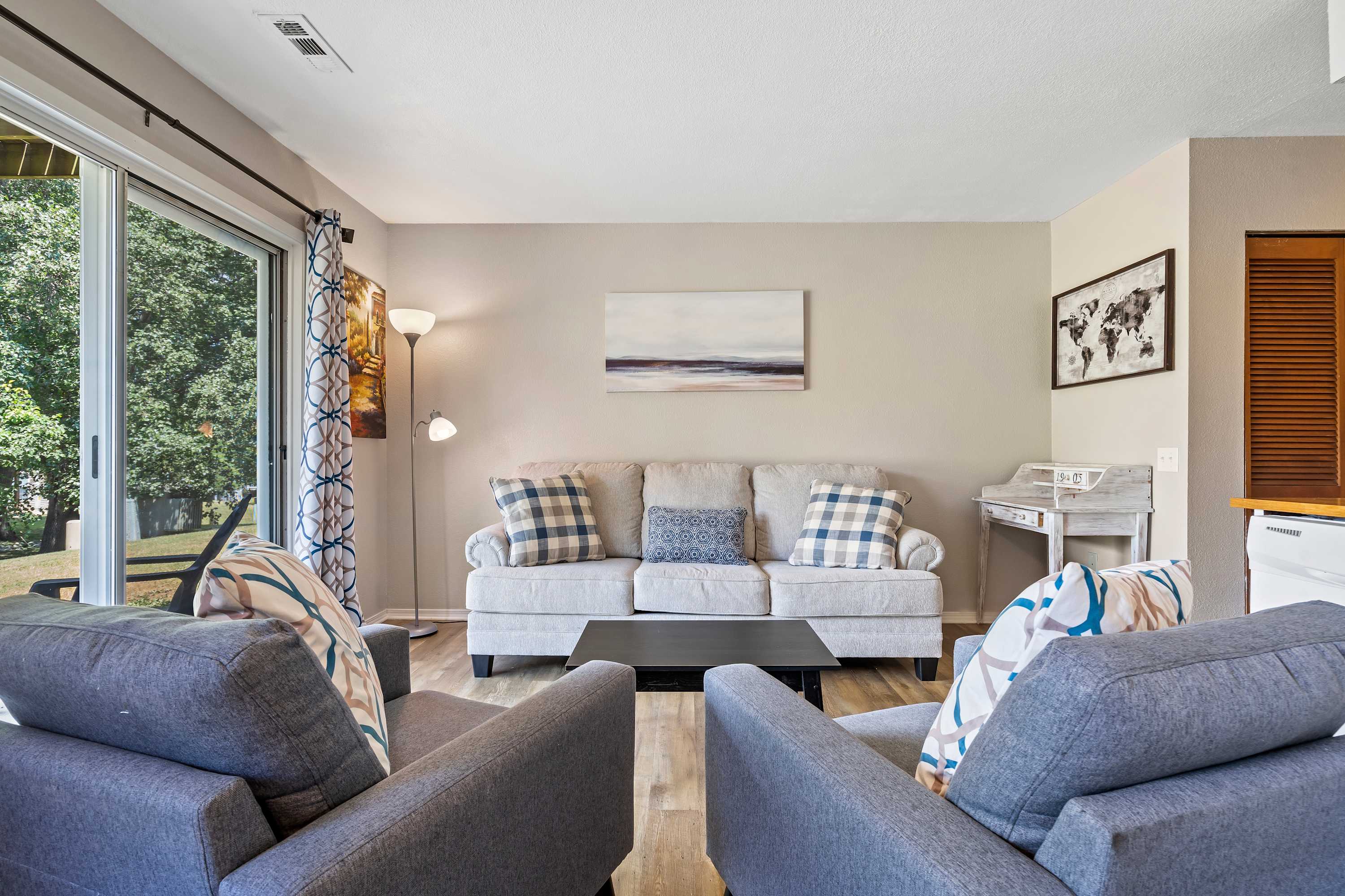 Living room is equipped with ample seating space