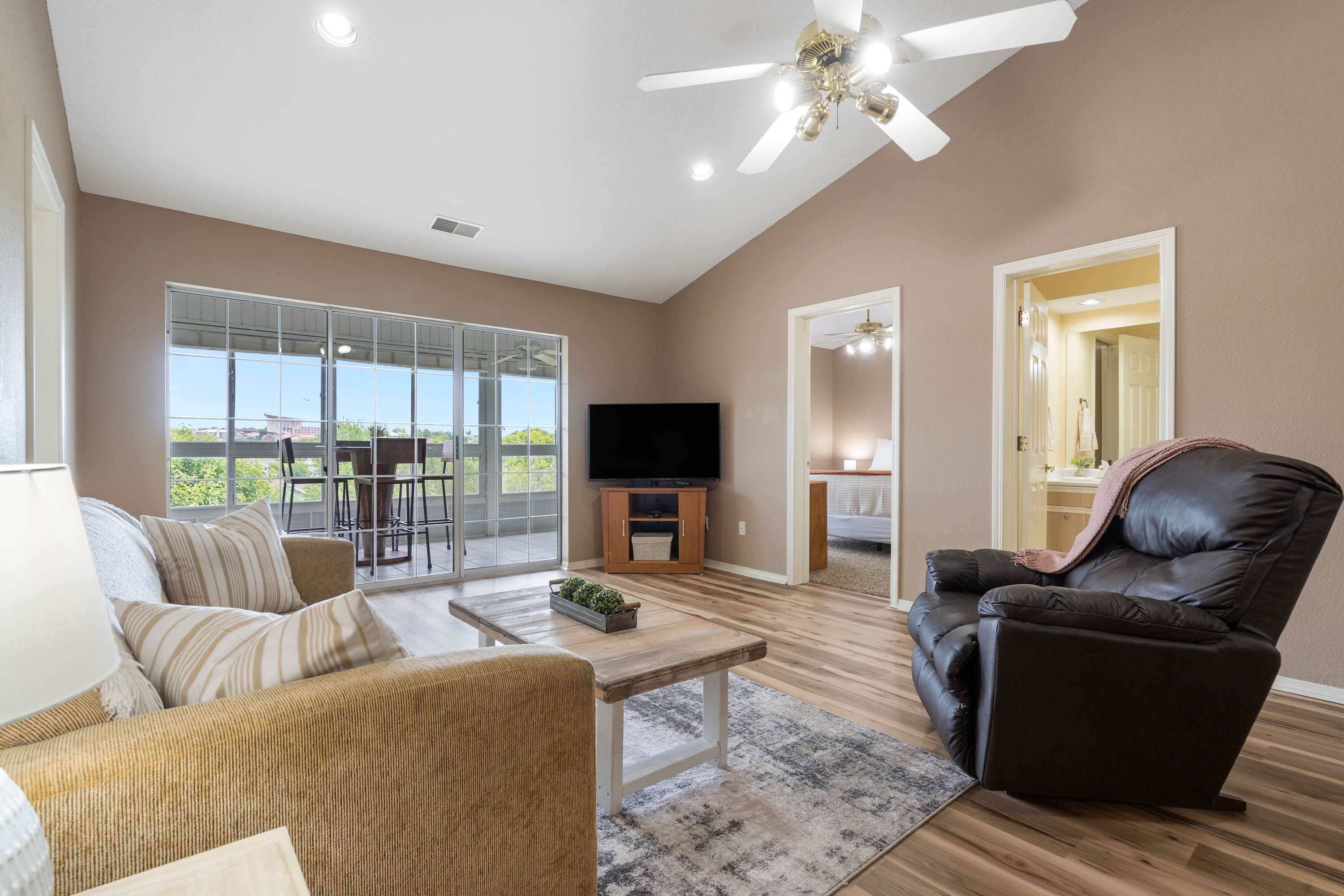 Living room with near floor to ceiling outlook of Branson views