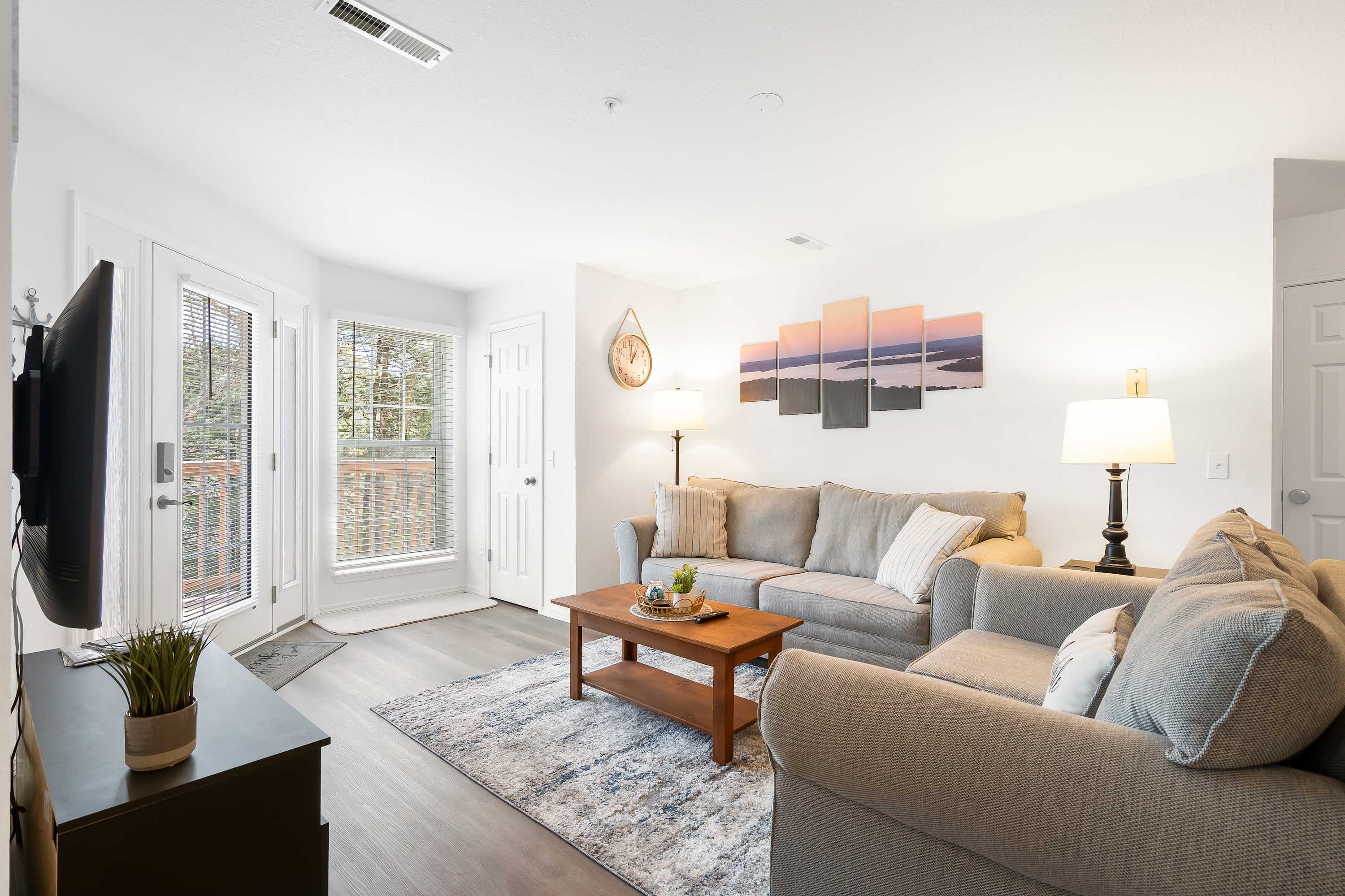 Open living space with comfy seating and, Smart TV