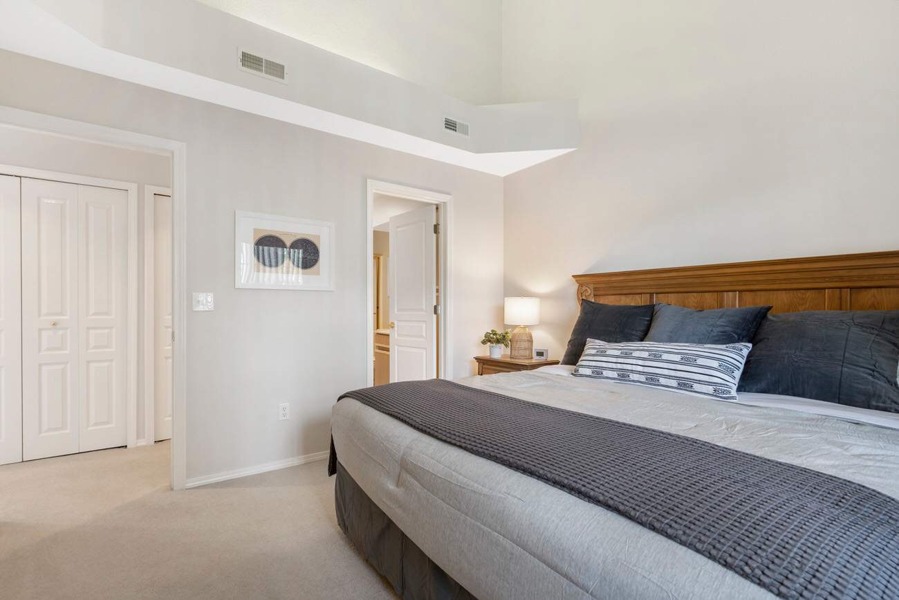 Bedroom 2 with King bed, TV, and shared en-suite (Main floor)