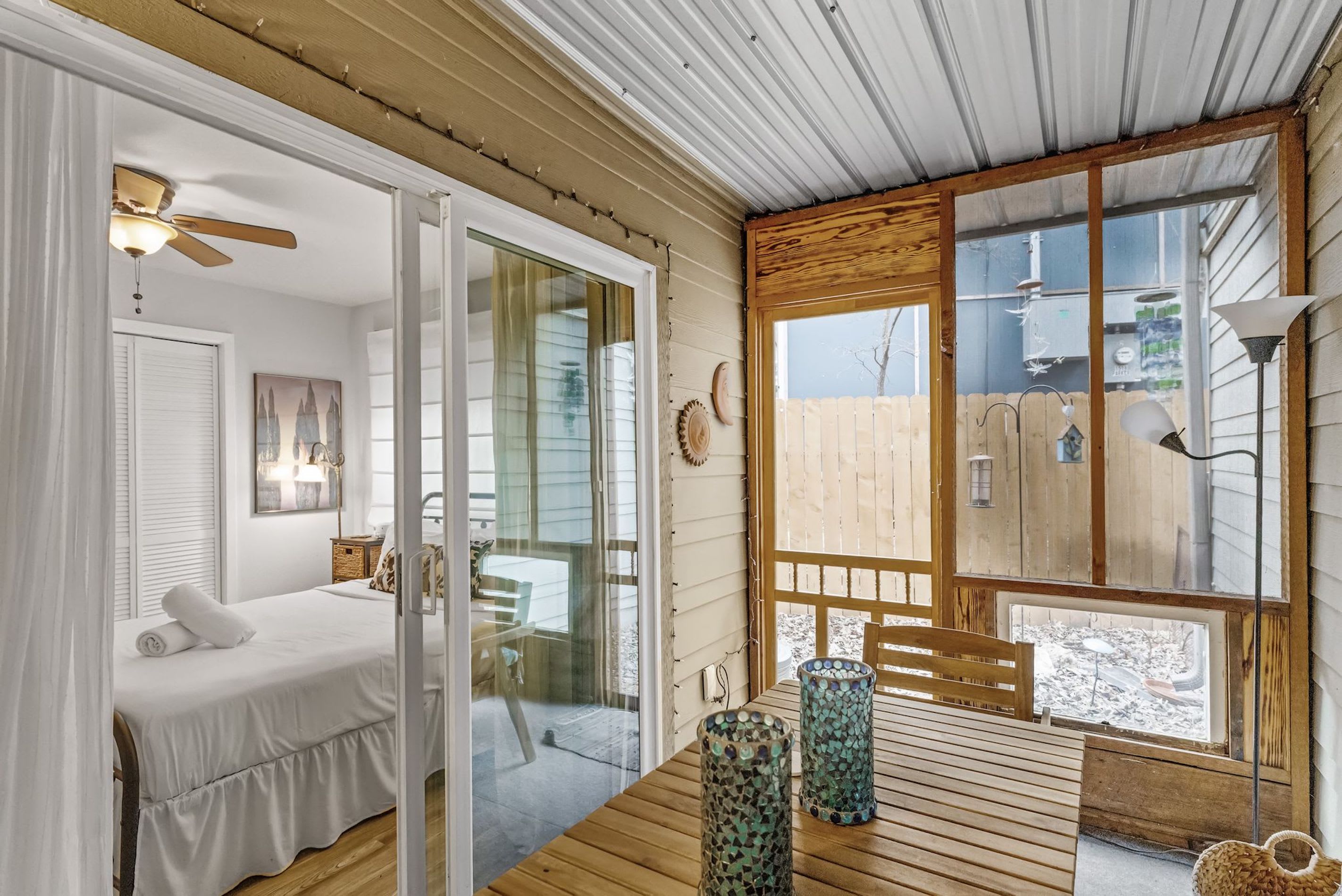 Indulge in the refreshing breeze and sunlight of the screened patio