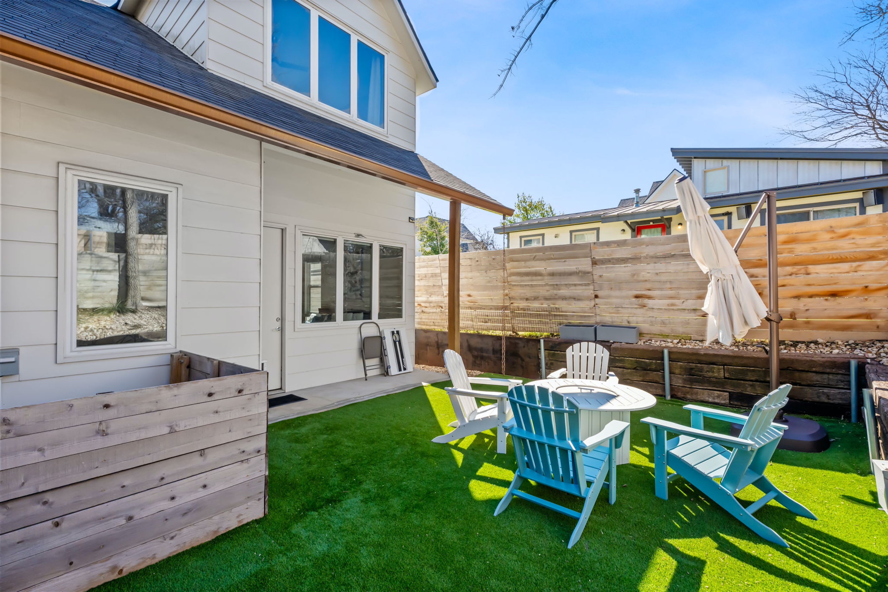 Dine alfresco or lounge by the firepit in the spacious, private back yard