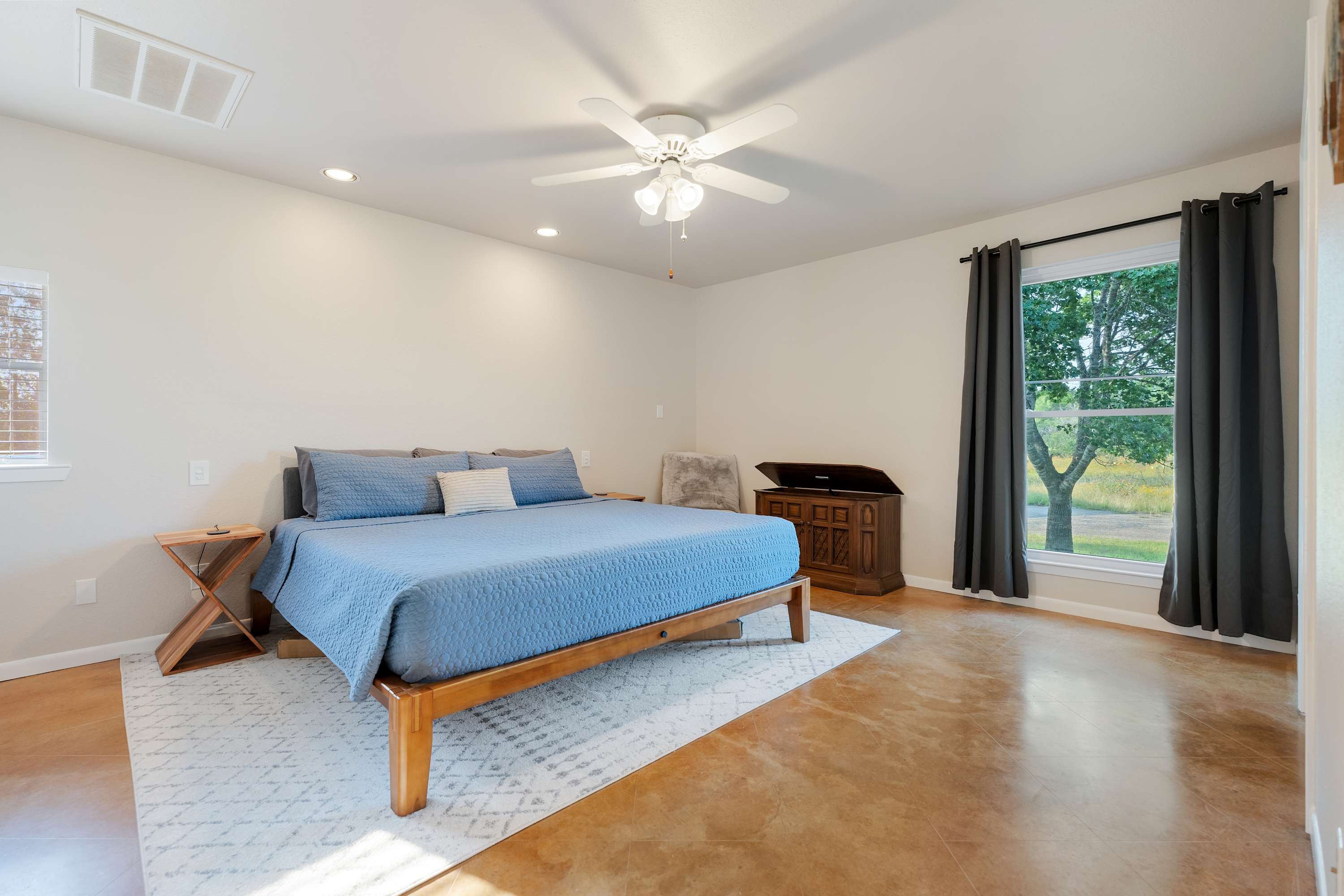 The main house kitchen is spacious and open, offering counter seating for 3
