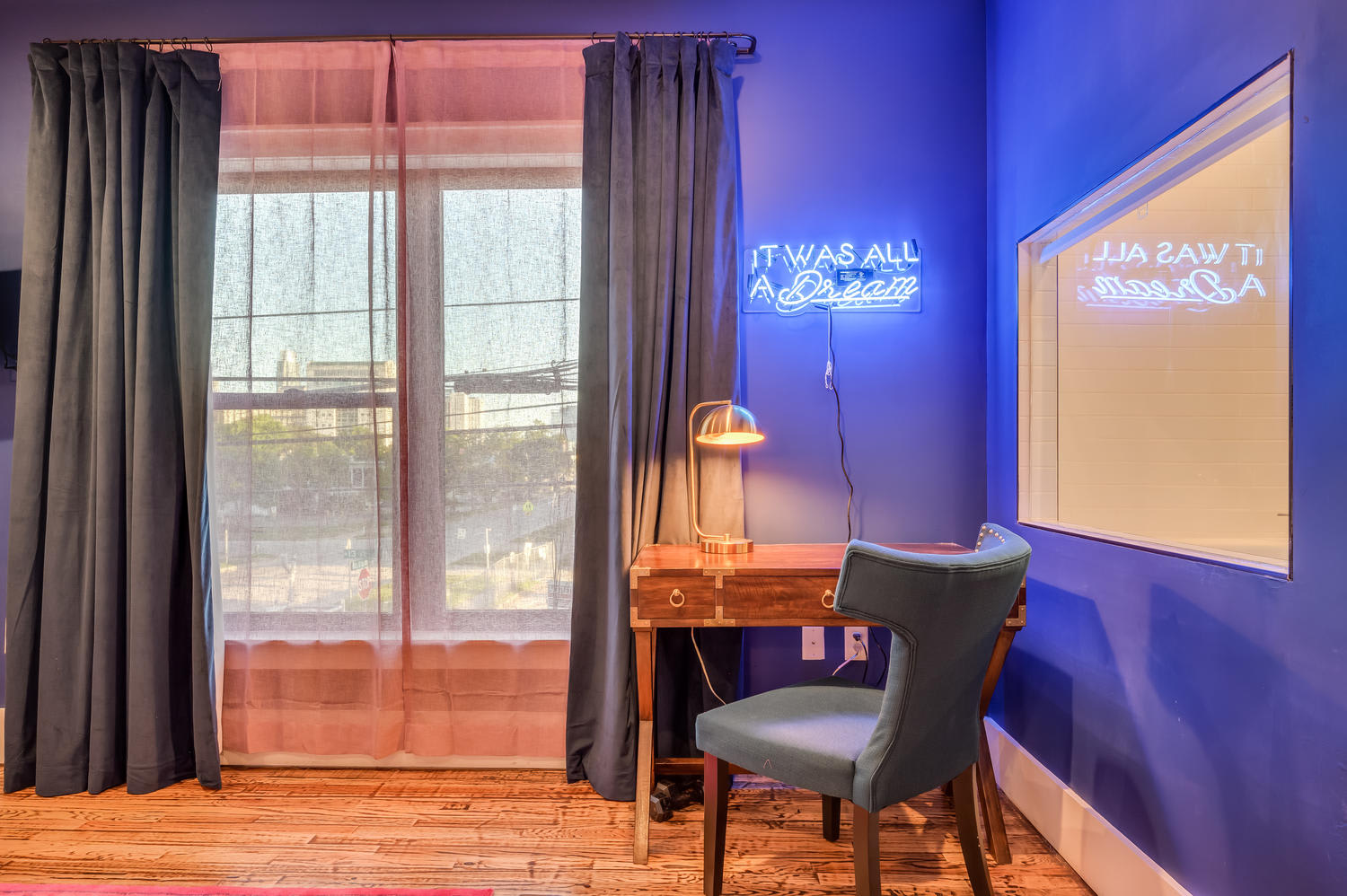 Suite 203 – The 2nd Floor Blue Mid-Century Suite offers Casper King and Queen Beds, Smart TV, and En Suite Bathroom