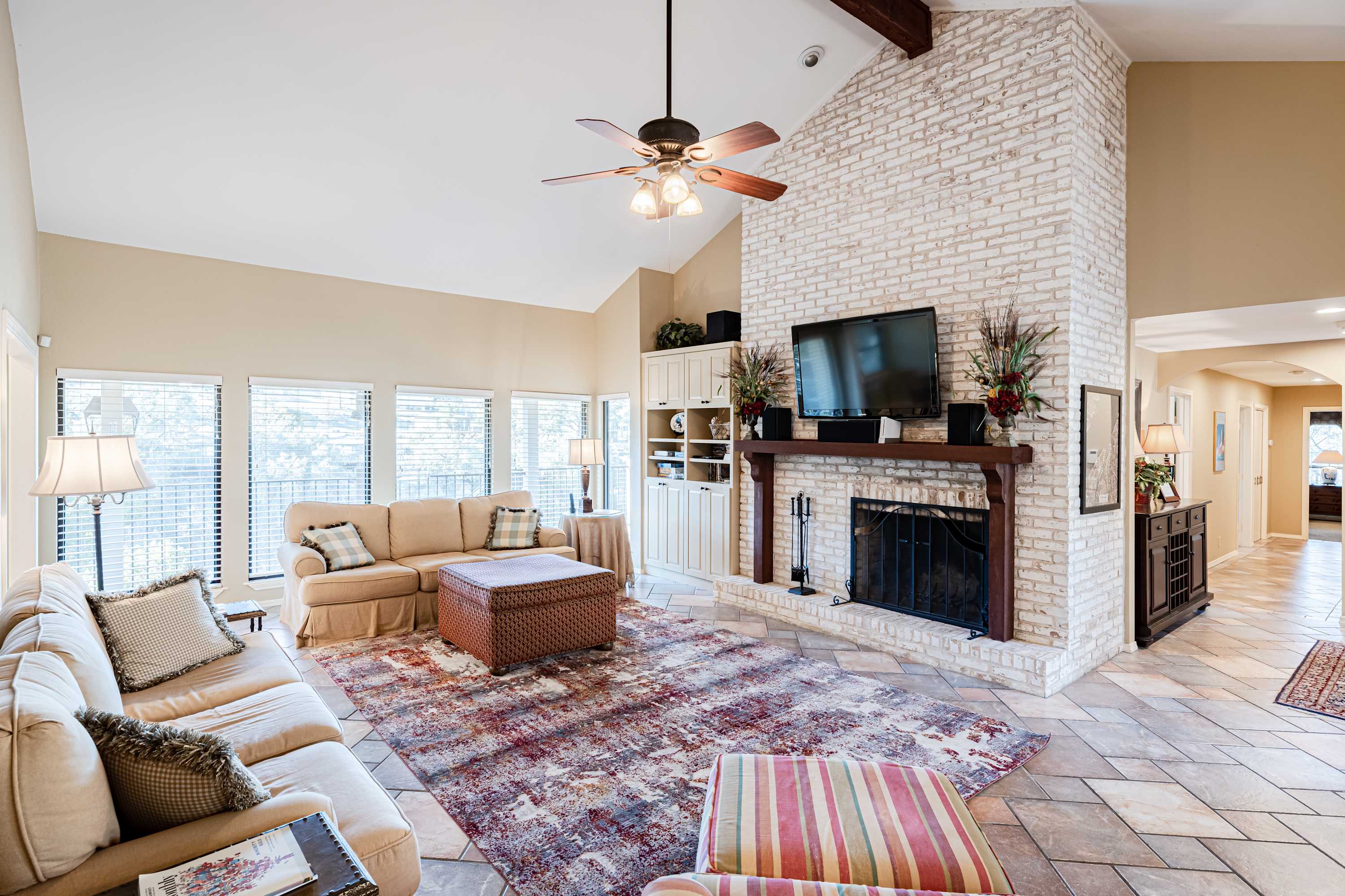 Modern spacious living area with TV