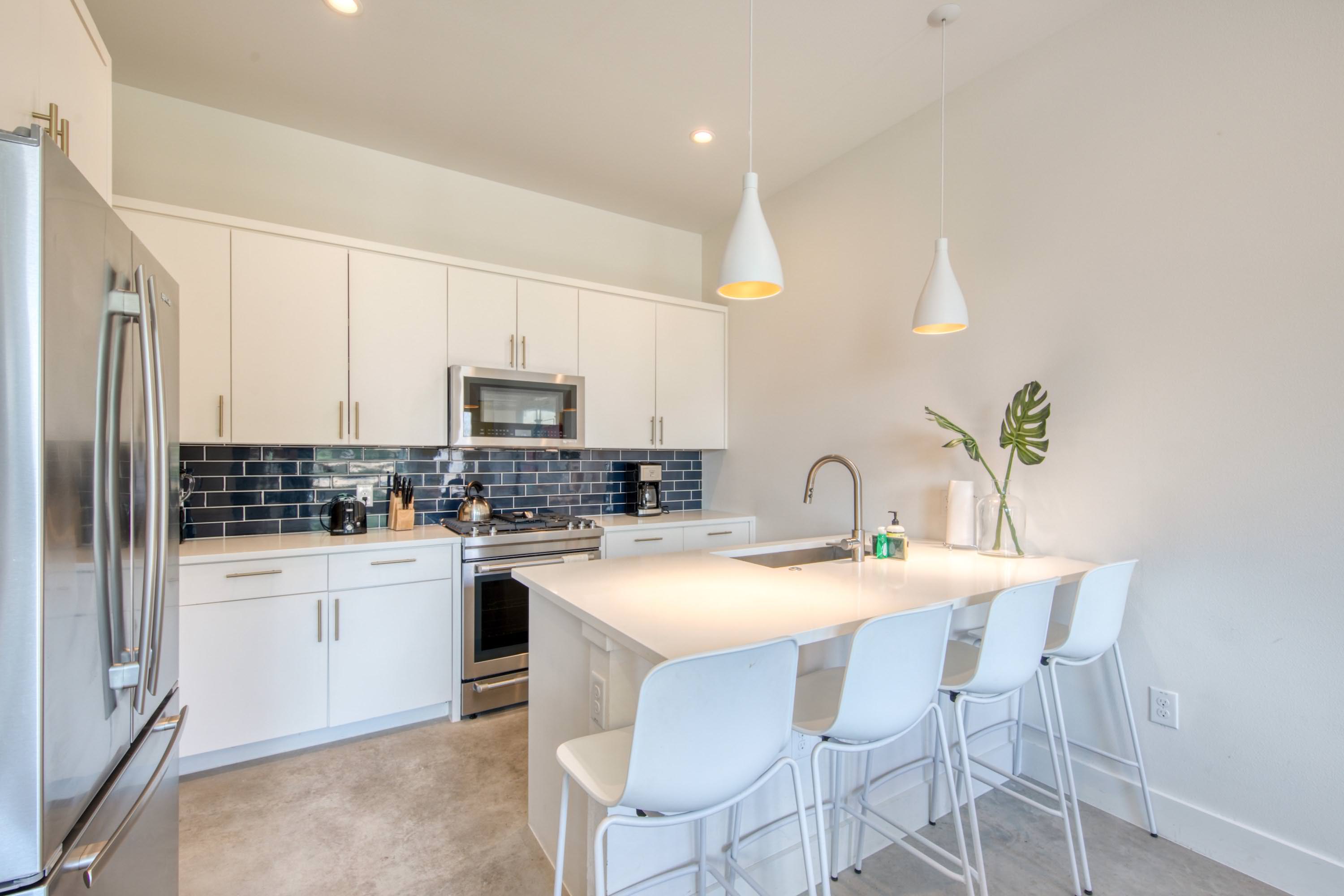 Kitchen with drip coffee maker, toaster, blender, and more