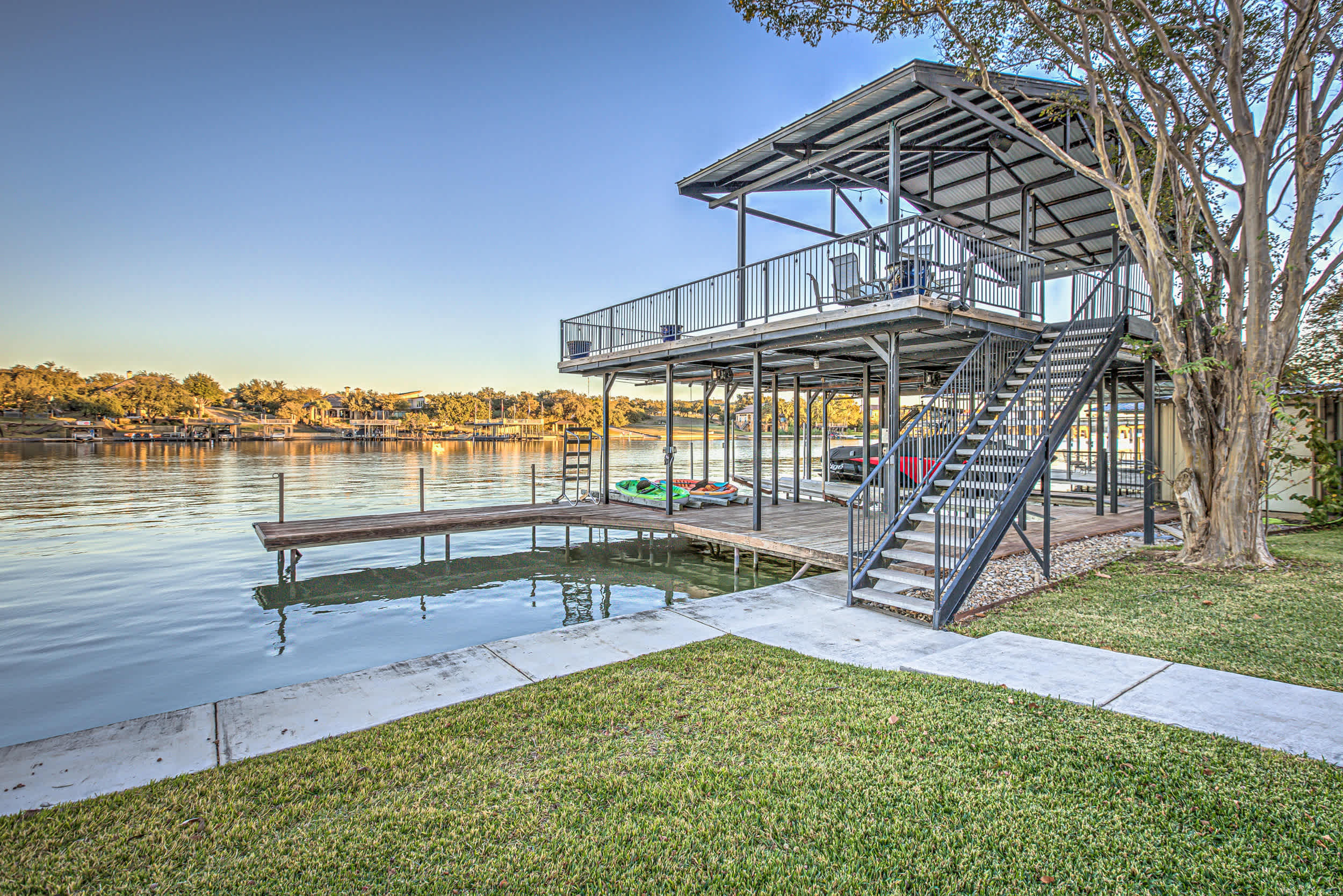 Spacious dock with outdoor seating and lake view