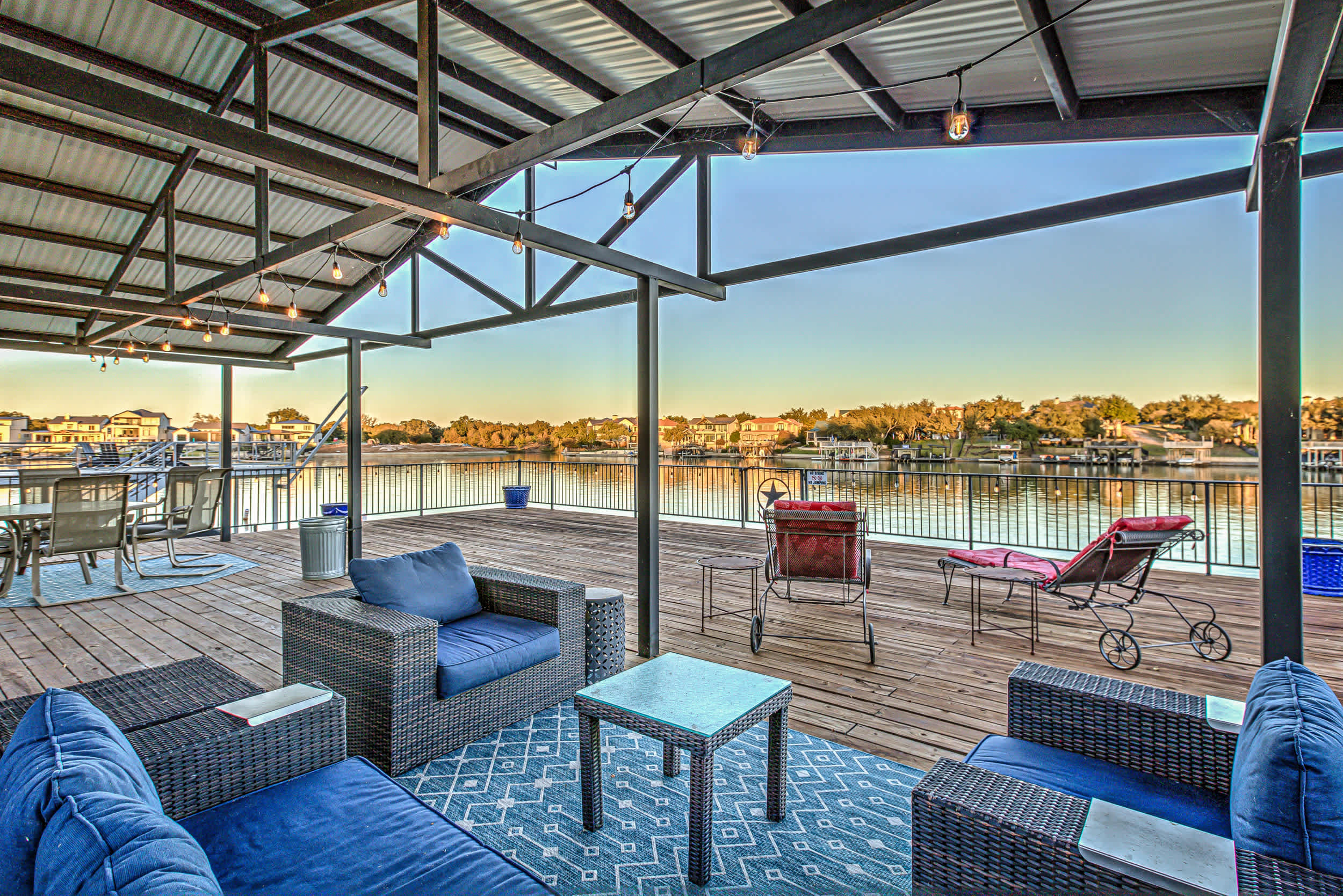 Spacious dock with outdoor seating and lake view