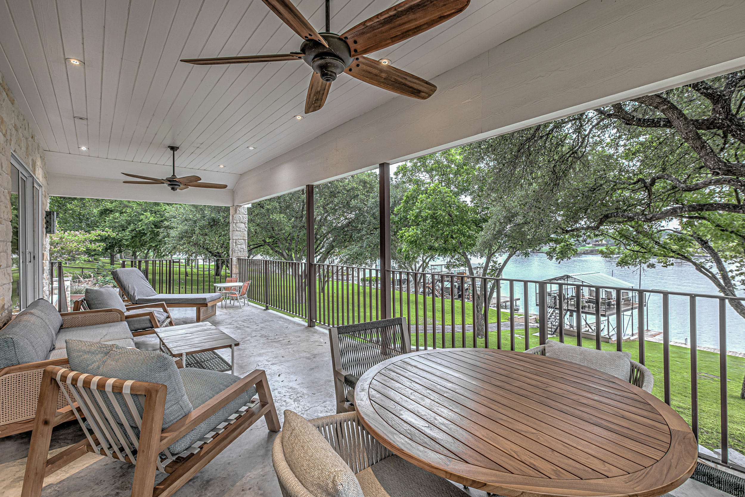 Large deck with outdoor seating and lake view