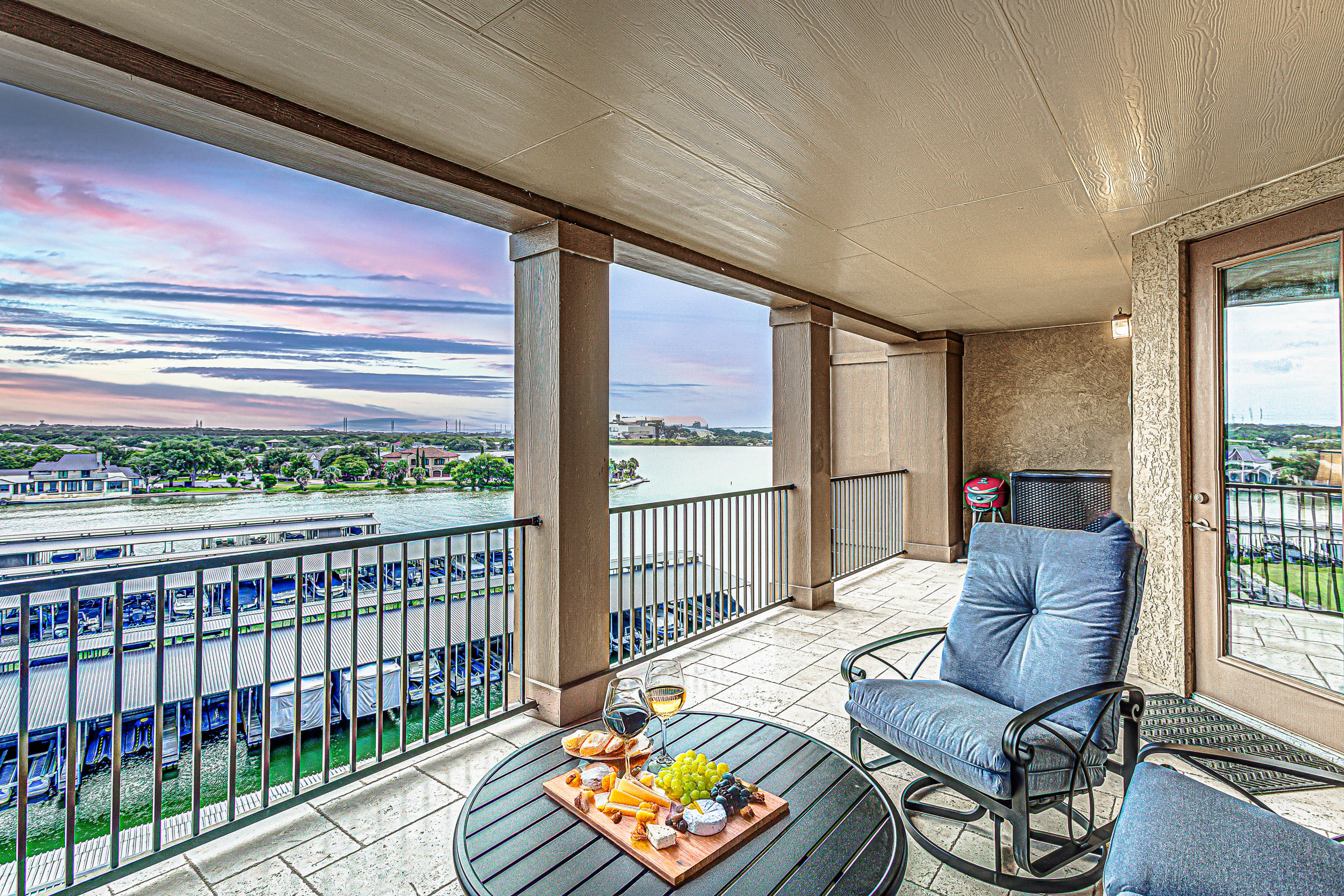 Savor sunset views over the marina from your private balcony retreat.
