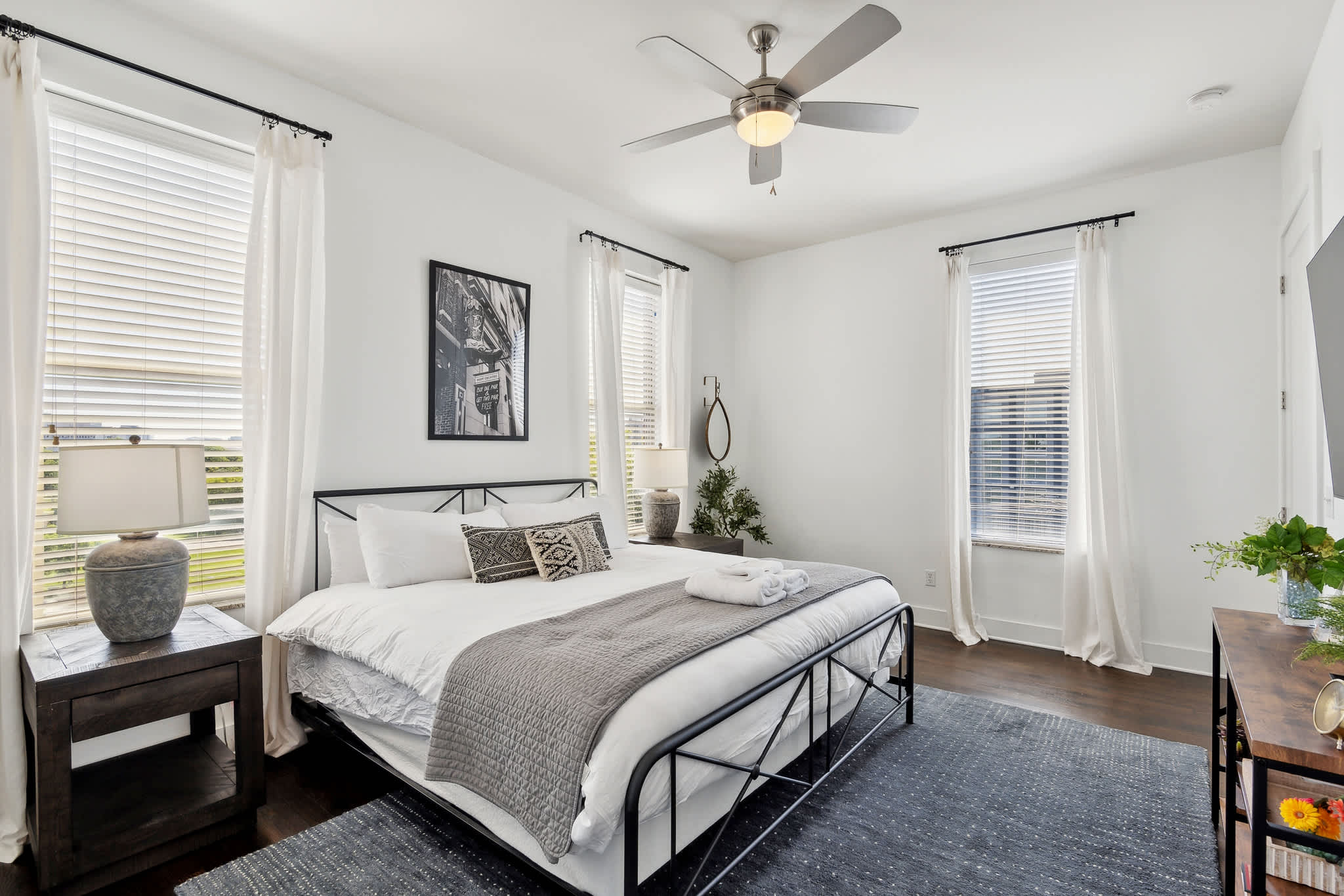 The elegant king suite boasts an ensuite bath, smart TV, ample natural light