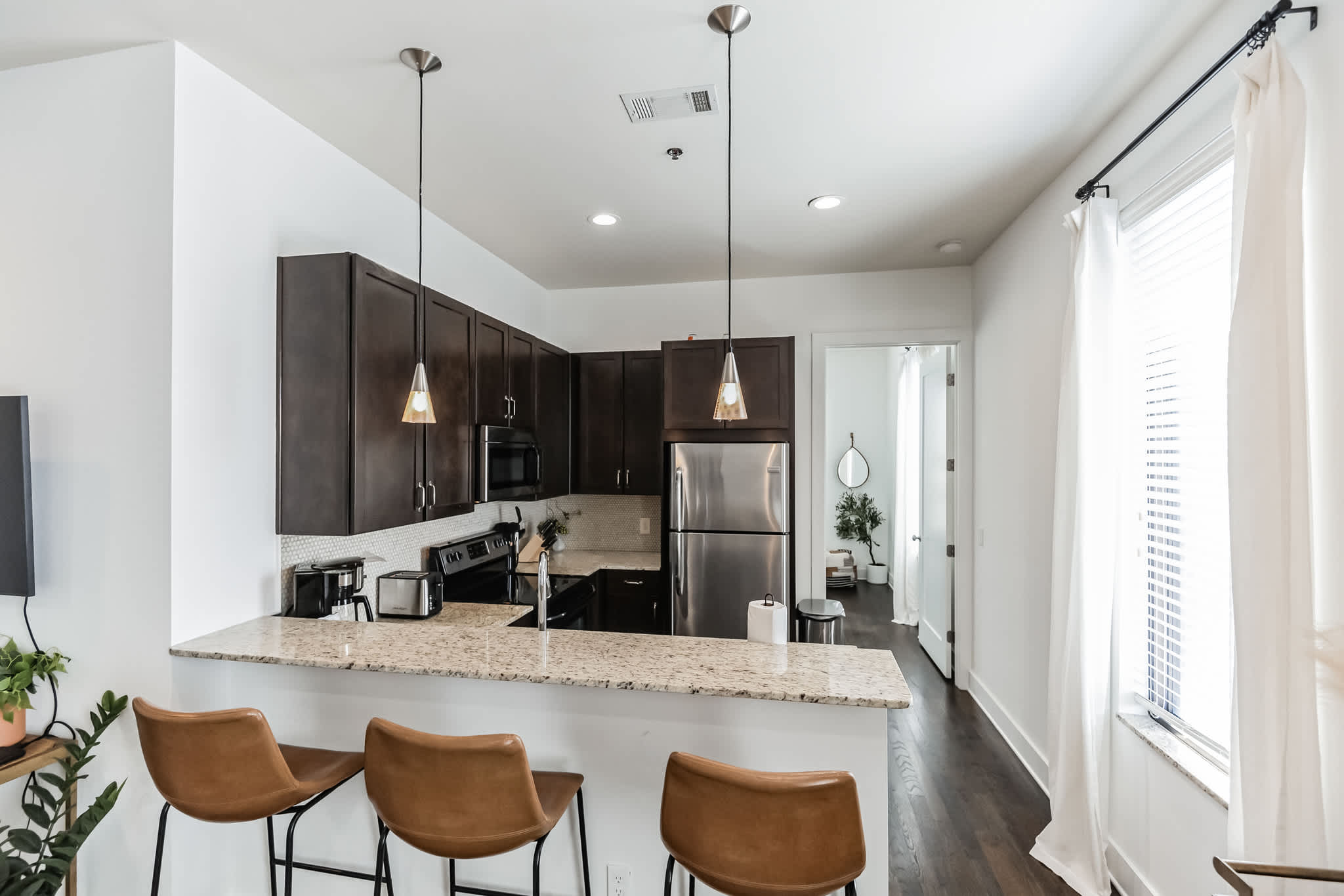 Sip morning coffee or grab a bite at the kitchen counter, seating 3