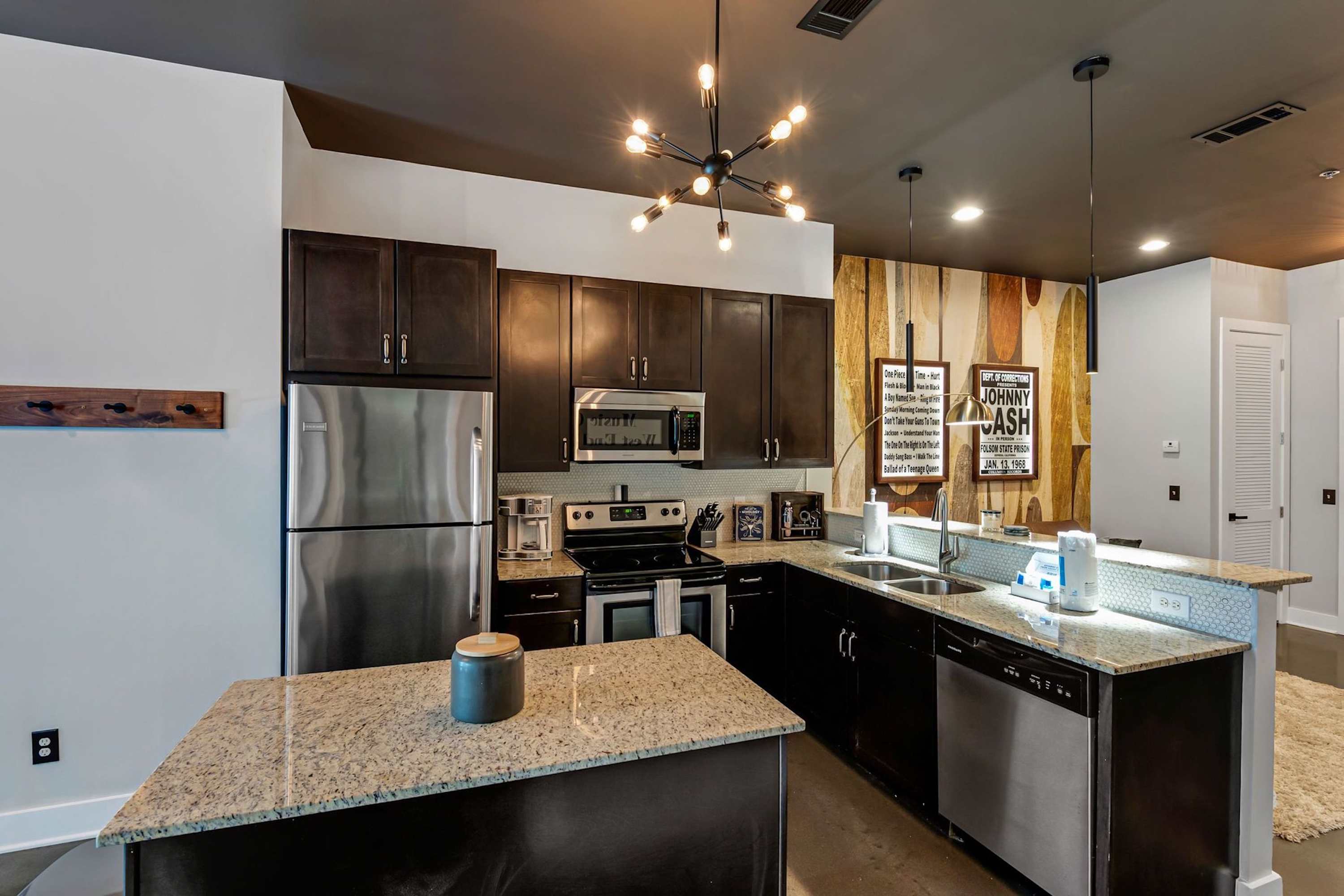 The chic, updated kitchen offers ample space & all the comforts of home
