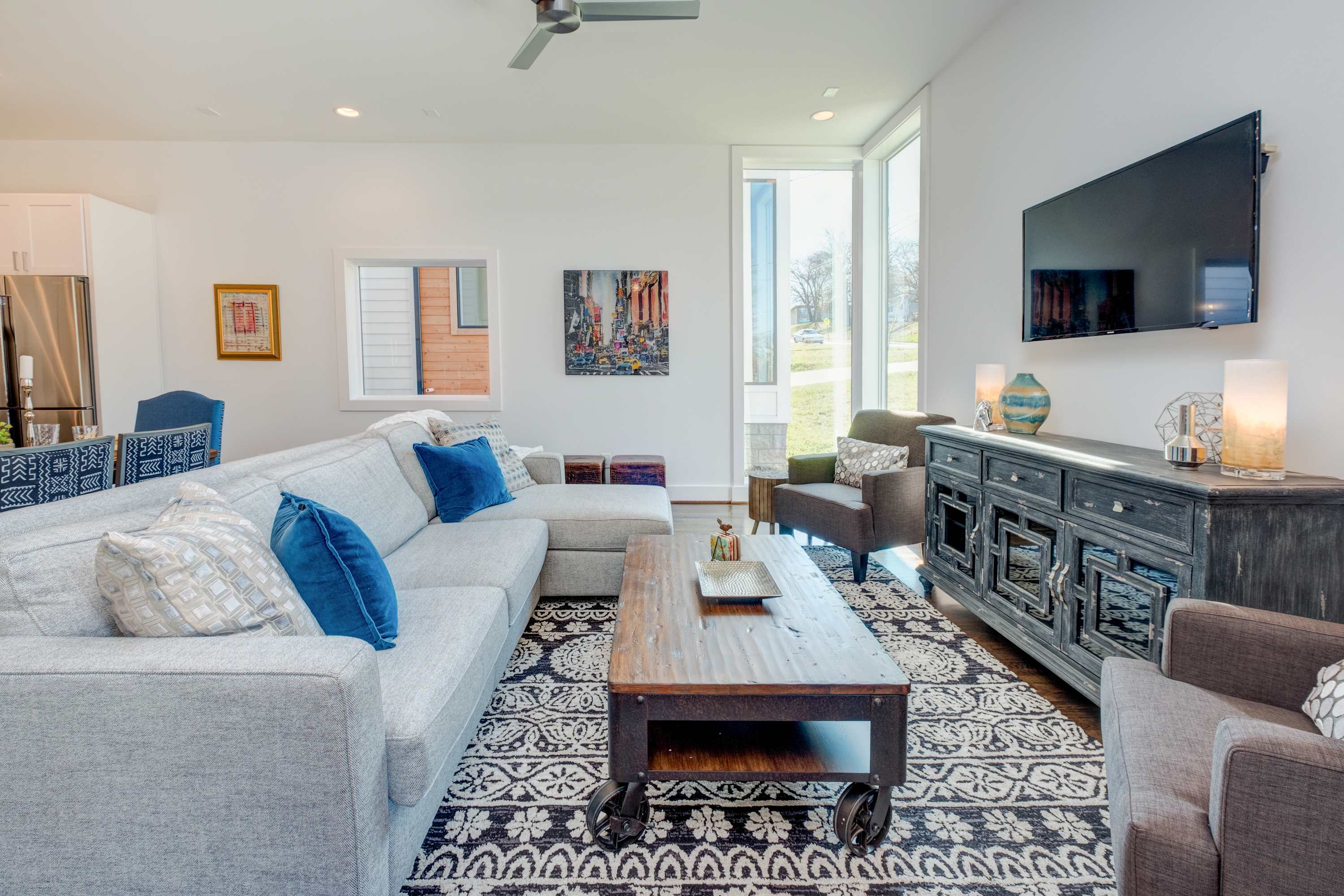 Open living space with sofa sleeper, and TV