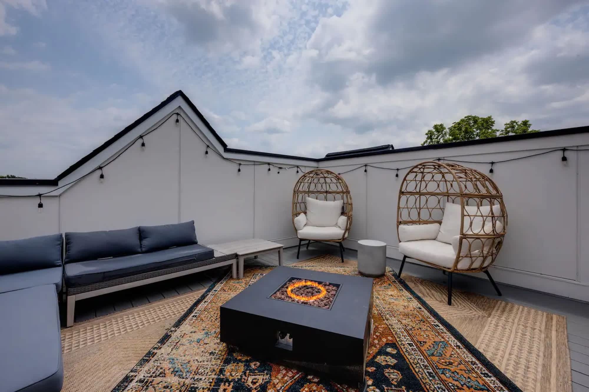 Rooftop deck with outdoor seating and firepit