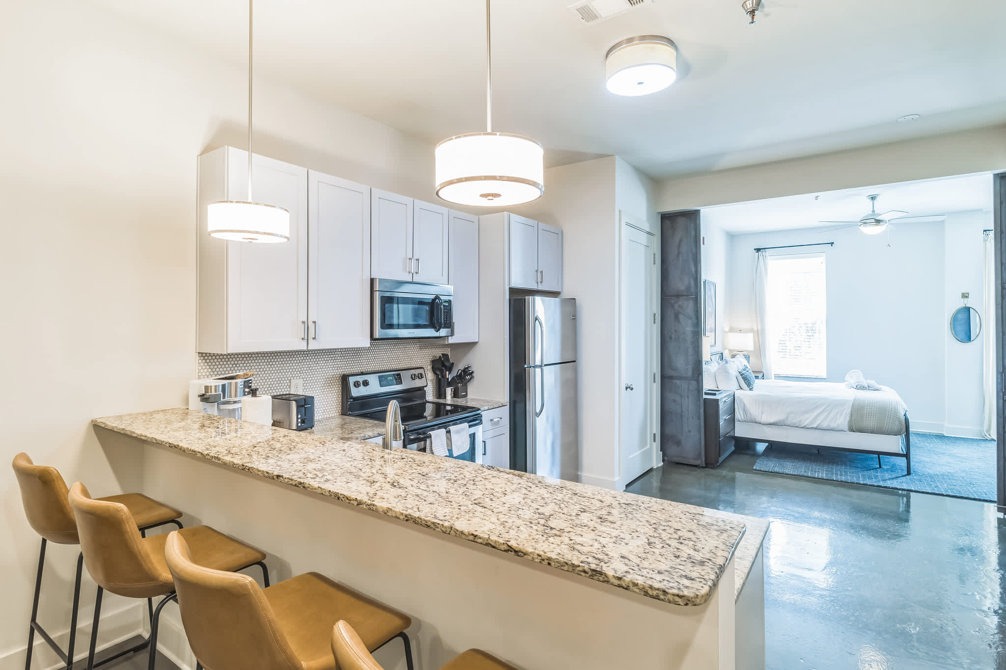 Sip morning coffee or enjoy gourmet bites at the kitchen counter, seating 4