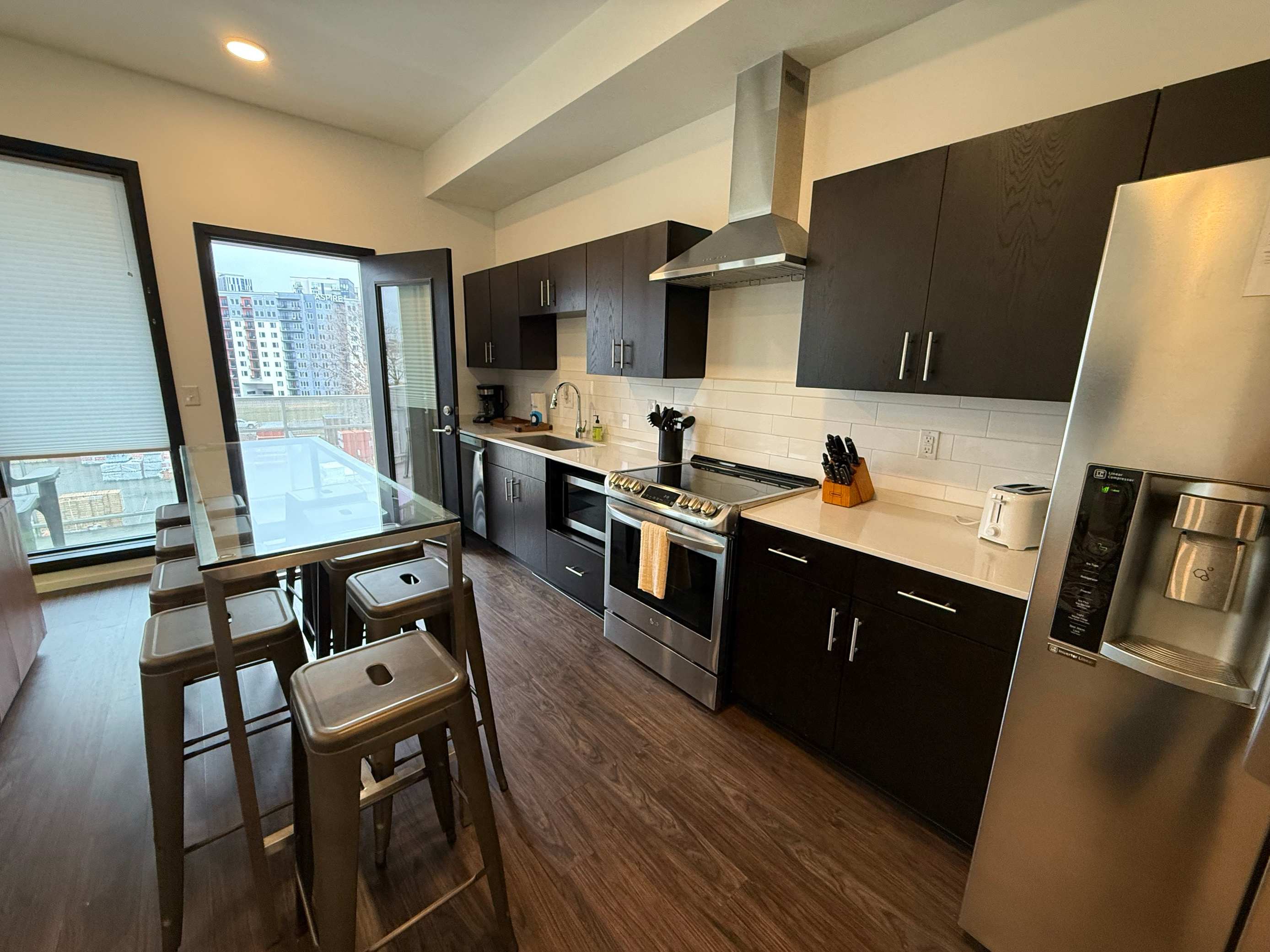 The stylish open kitchen offers ample space & every home comfort