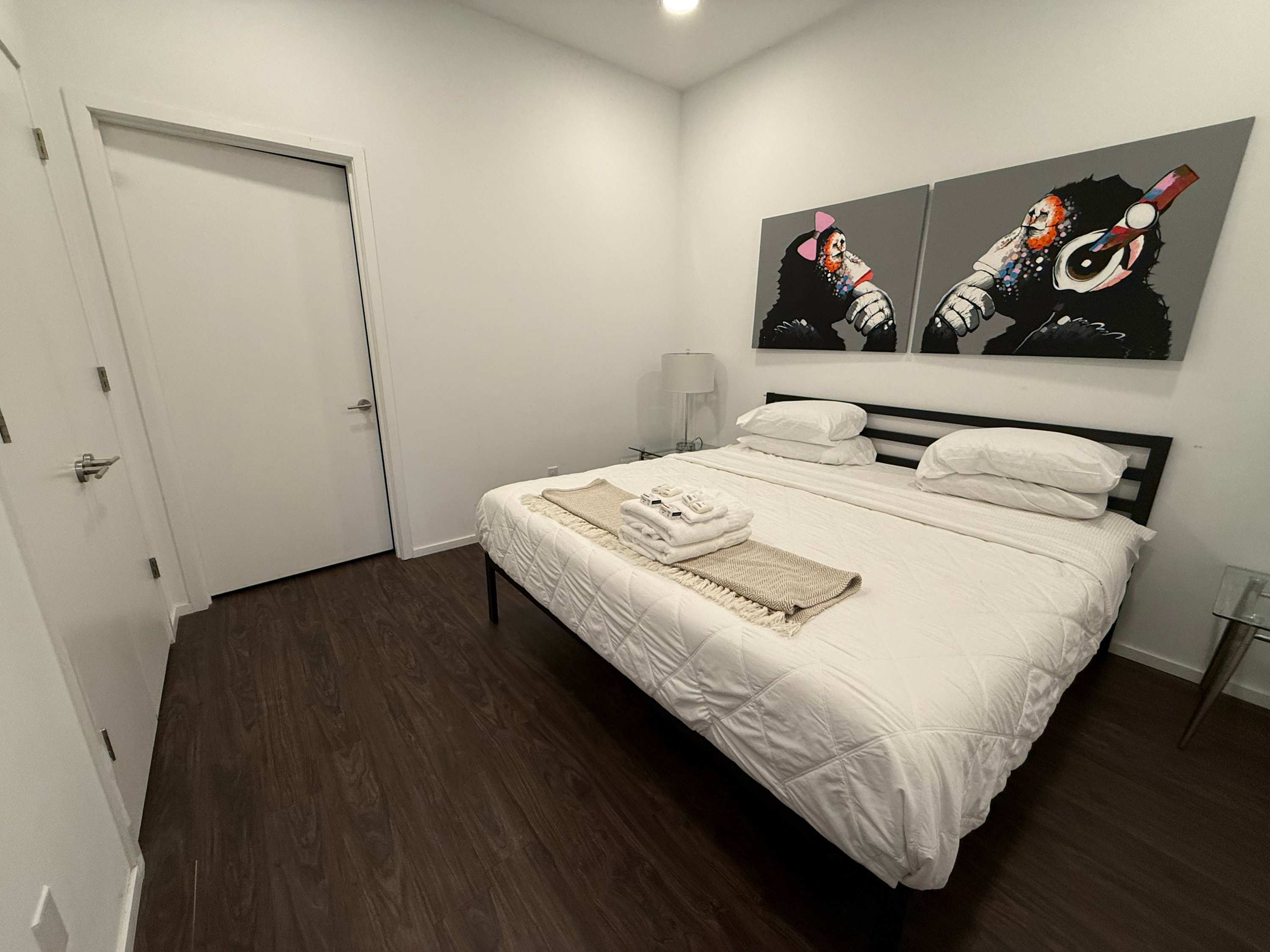 A plush king bed awaits in the bedroom retreat