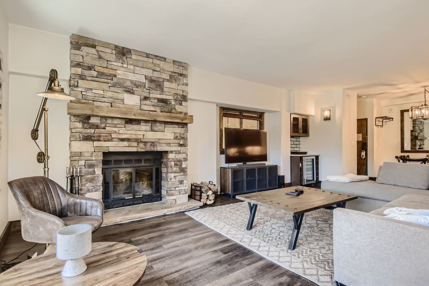 Living room with a wood fireplace to cozy up and enjoy a night in