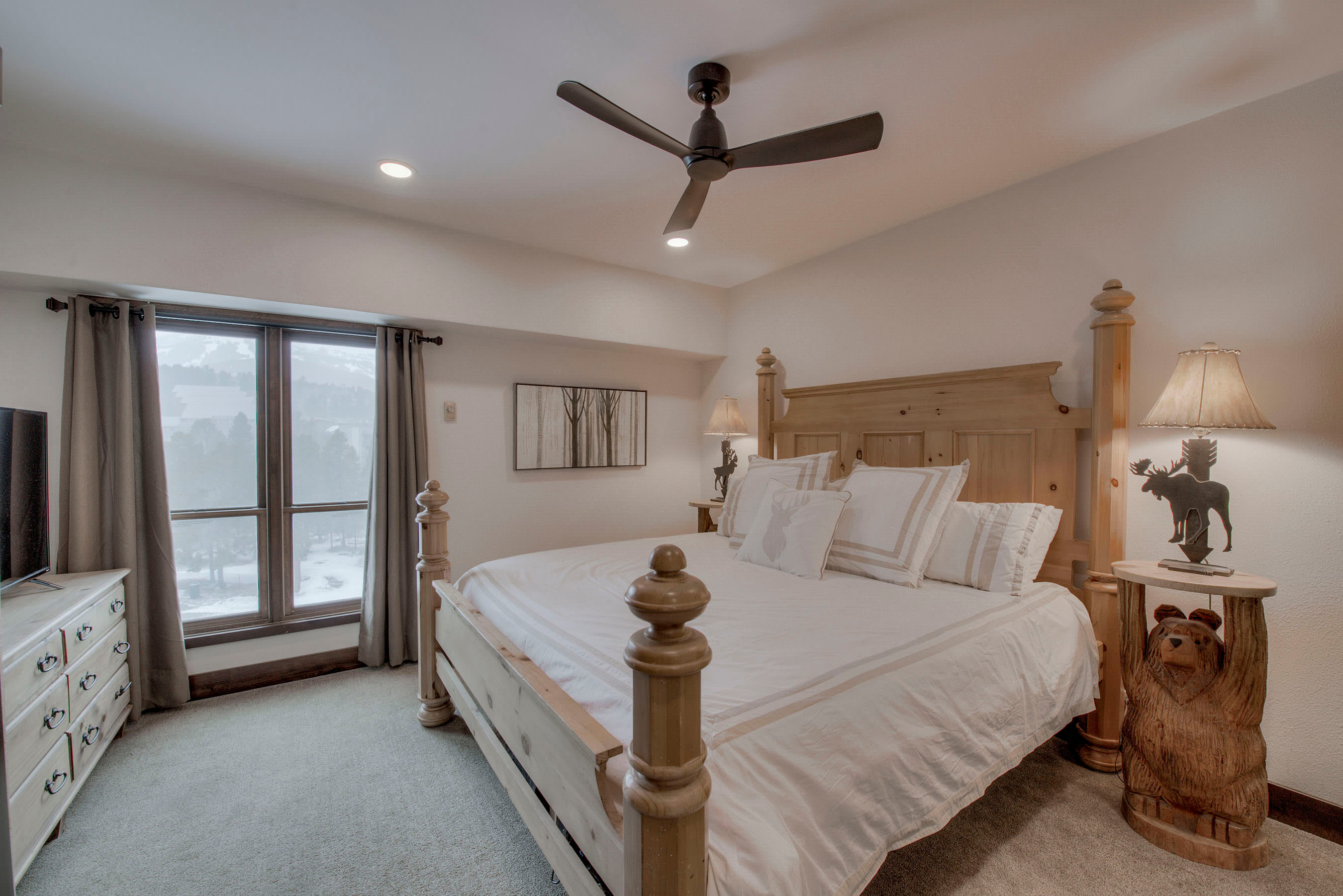 Master bedroom King bed with flat screen TV and en suite bathroom