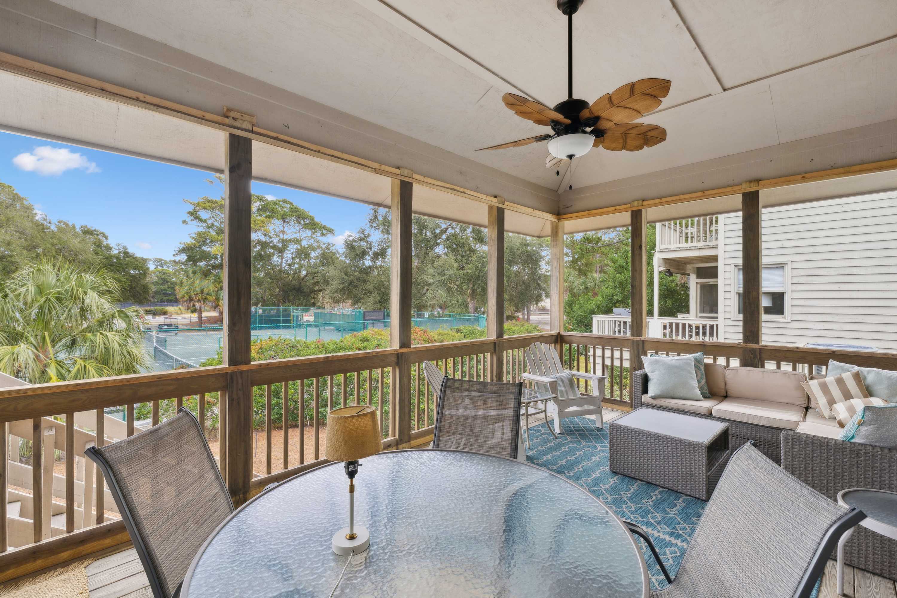 Take in the fresh air on the screened in patio with outdoor seating 