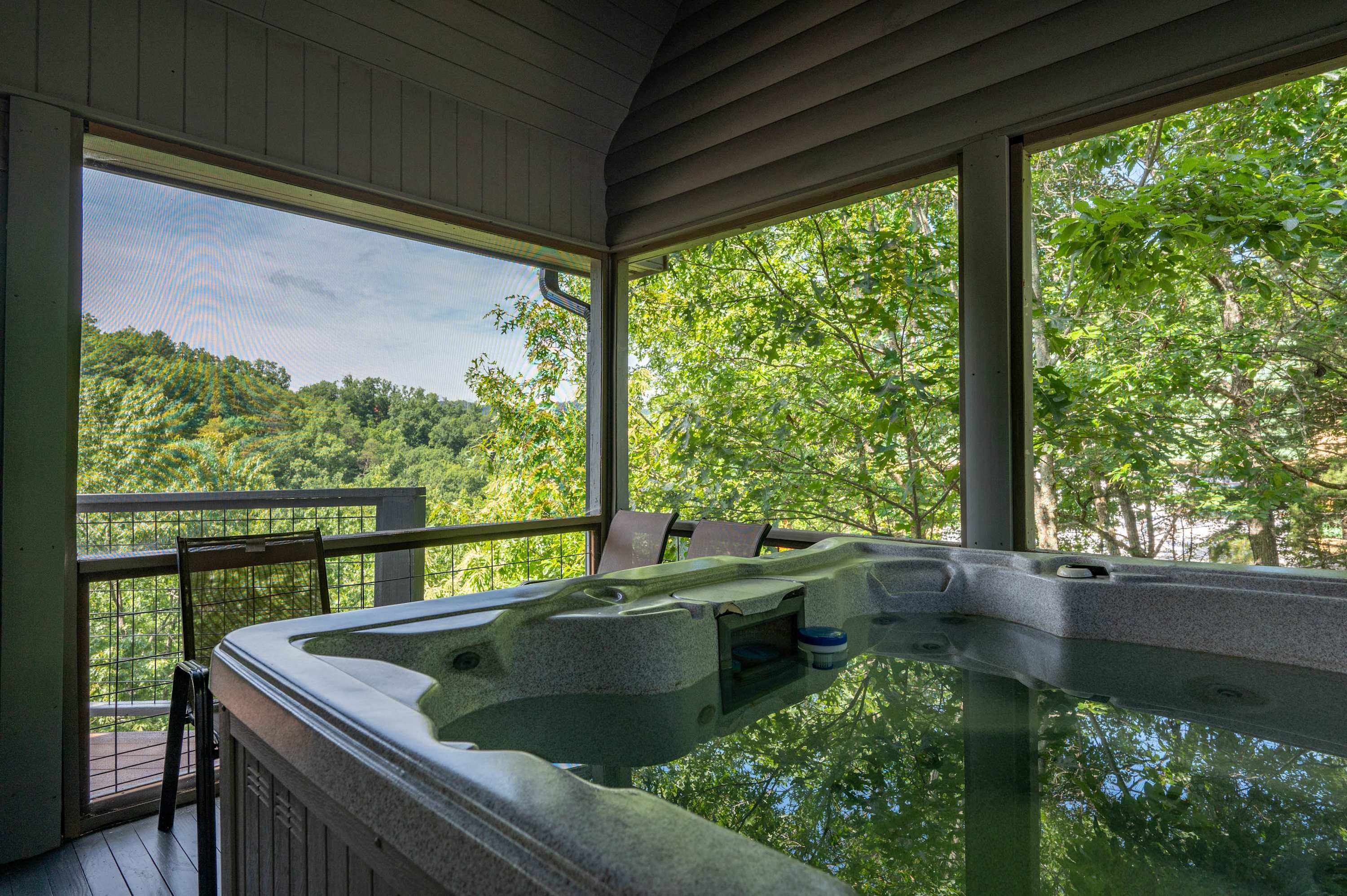 Soak your cares away with serene nature views in the private hot tub